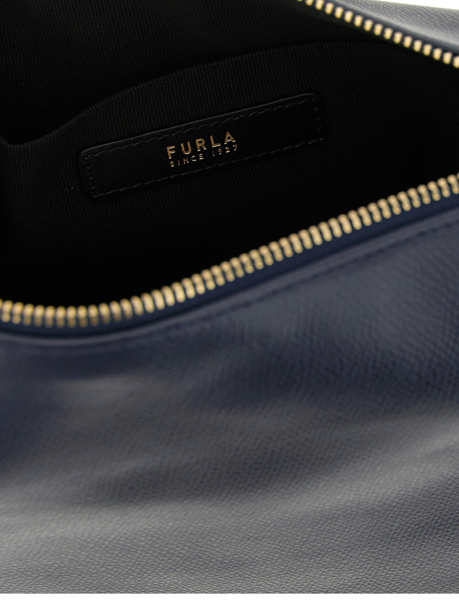 Discover the FURLA Tonie shoulder bag, a luxurious blend of fine calfskin leather and modern elegance, perfect for those who appreciate timeless sophistication.