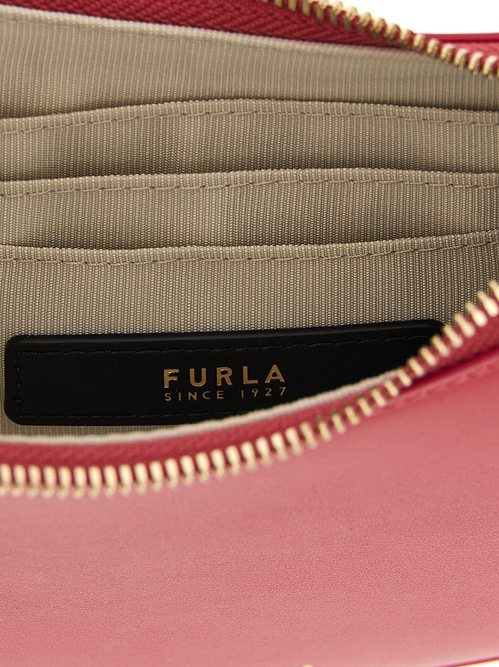 Discover the Furla Fuchsia Calfskin Shoulder Bag, a masterpiece of artisanal luxury crafted from exquisite calfskin leather, perfect for elevating your style.