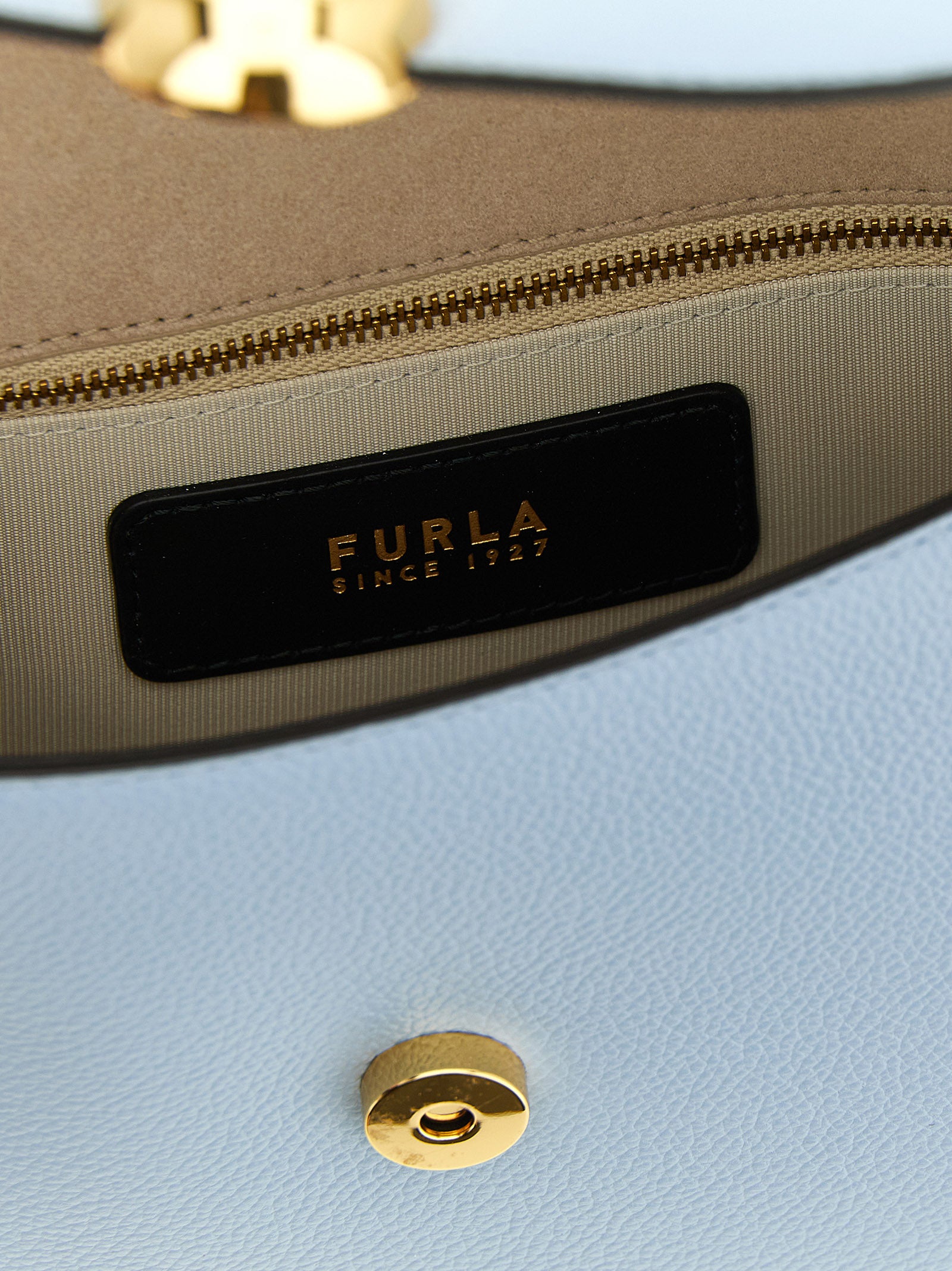 Experience the allure of the Furla Blue Calfskin Crossbody Bag, a timeless luxury crafted from exquisite calfskin, embodying sophistication for the discerning individual.