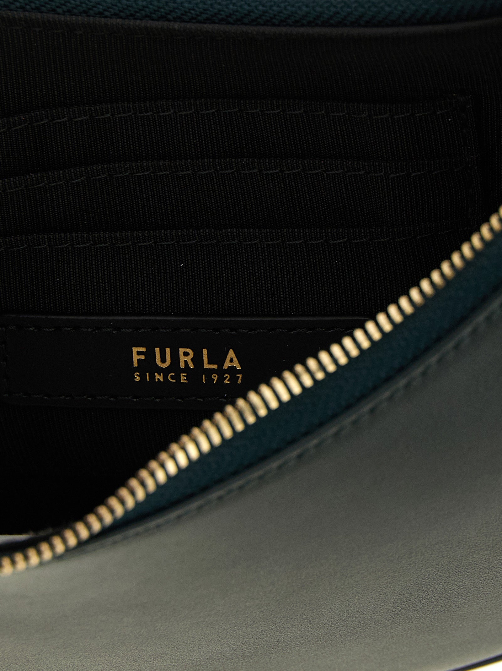 Discover the Furla Bicolor Calfskin Shoulder Bag, a masterpiece of artisanal elegance crafted from premium calfskin, perfect for those who appreciate timeless luxury.