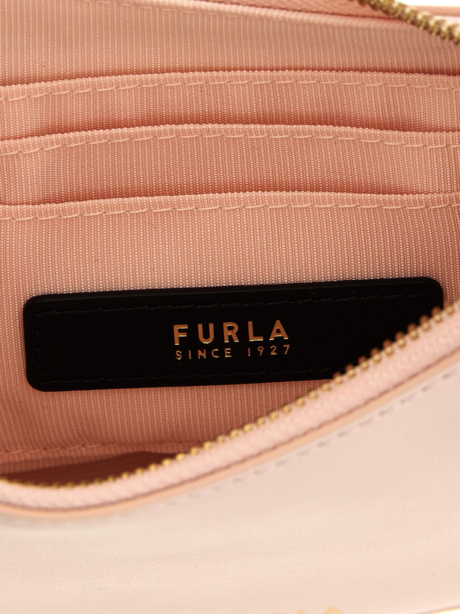Discover the FURLA Delizia Mini Leather Shoulder Bag, a masterful blend of artisanal craftsmanship and luxurious calfskin, perfect for elevating your style.