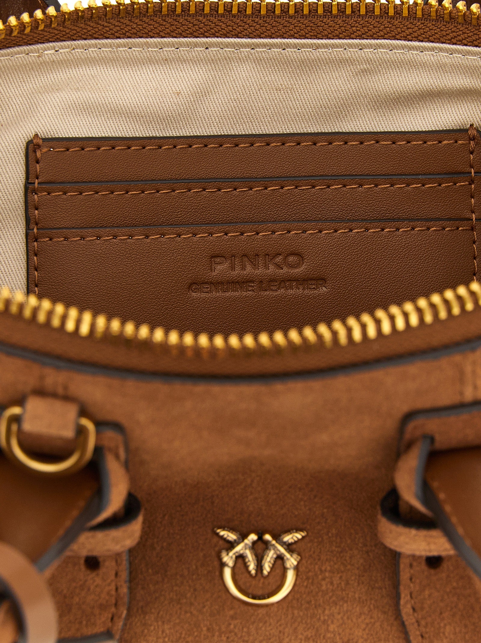 Discover the PINKO Bowling Baguette, an artisanal masterpiece in rich brown cow leather, embodying timeless elegance and sophisticated allure for the discerning individual.