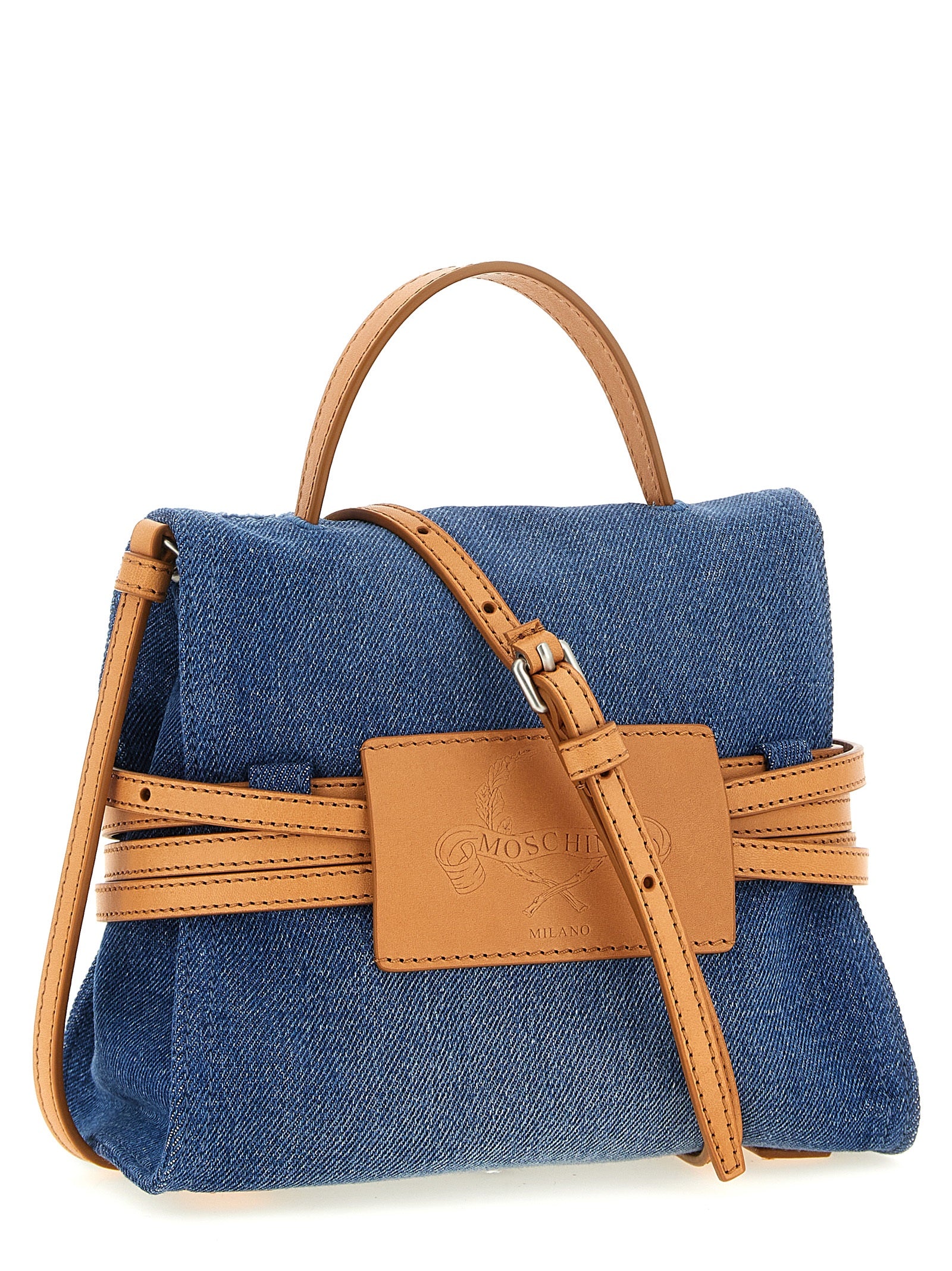 Indulge in the Moschino Blue Cotton Handbag, a luxurious blend of denim and leather, handcrafted in Italy to elevate your style with bold sophistication.