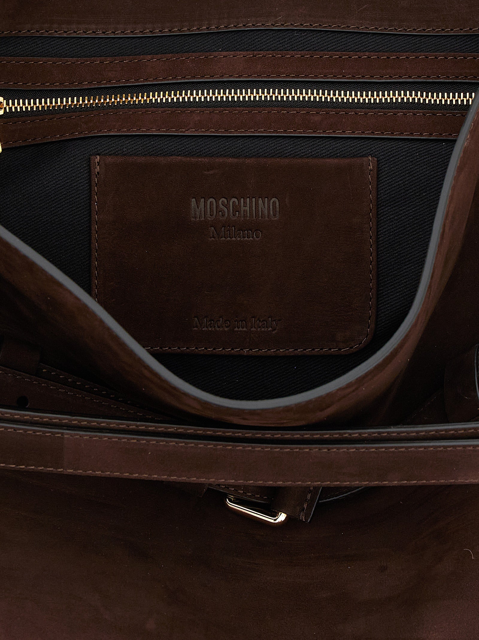 Discover the Moschino Brown Calfskin Shoulder Bag, a symbol of artisanal luxury and sophistication, crafted from exquisite calfskin leather for the discerning individual.
