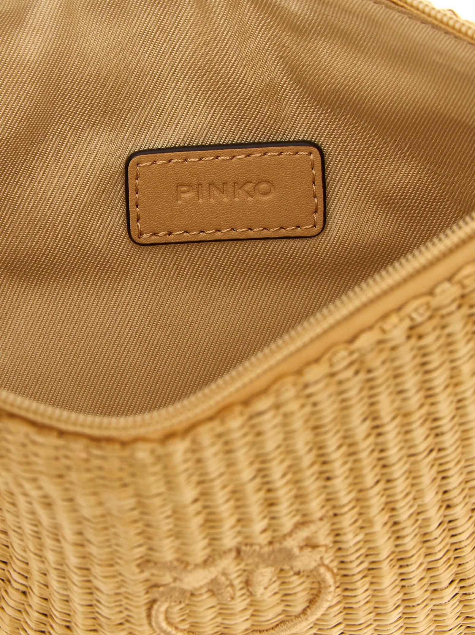 Discover the PINKO Beige Polypropylene Clutch Bag, a handcrafted masterpiece adorned with intricate embroidery, perfect for elevating any sophisticated ensemble.
