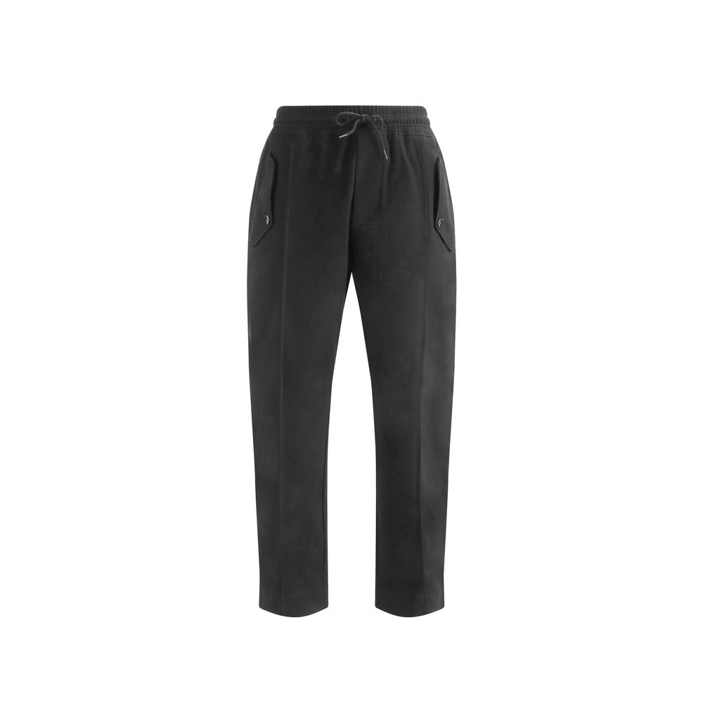Indulge in the Moschino Black Cotton Joggers, where Italian craftsmanship meets luxurious comfort, perfect for the discerning individual seeking effortless elegance.