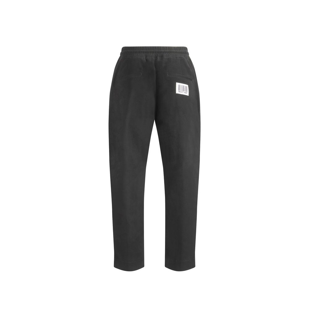 Discover the Moschino Black Cotton Joggers, where Italian craftsmanship meets effortless luxury, offering a sophisticated blend of comfort and style for the discerning individual.