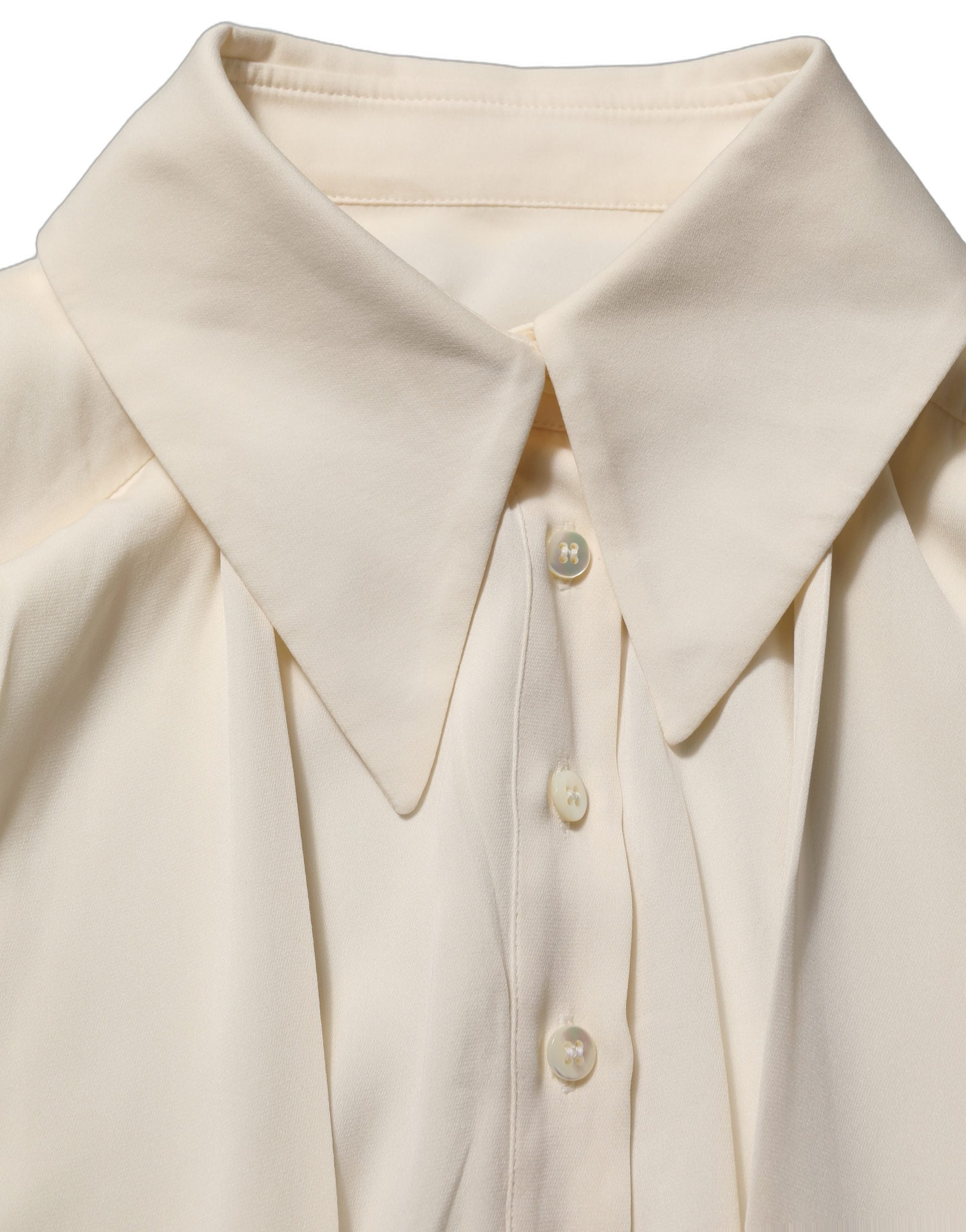 Experience the exquisite allure of the Dolce & Gabbana Off White Ascot Collar Blouse, a luxurious silk blend masterpiece that embodies timeless elegance and Italian craftsmanship.
