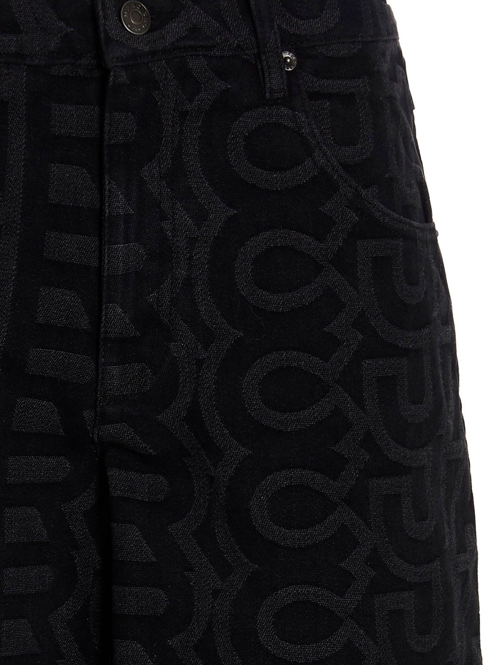 Elevate your style with Marc Jacobs' Monogram cotton blend denim jeans, a luxurious blend of sophistication and artistry, perfect for the discerning fashion connoisseur.