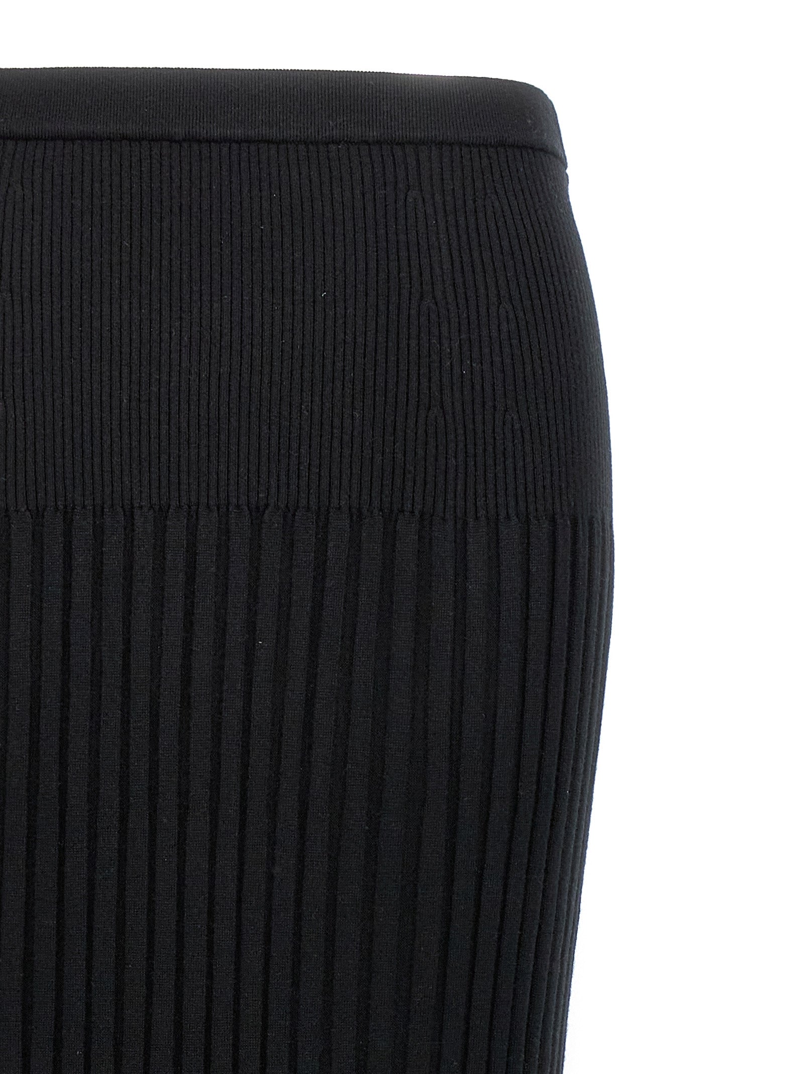 Indulge in the Proenza Schouler Black Silk Midi Skirt, a luxurious silk-cashmere blend that redefines elegance and sophistication for the discerning fashion connoisseur.