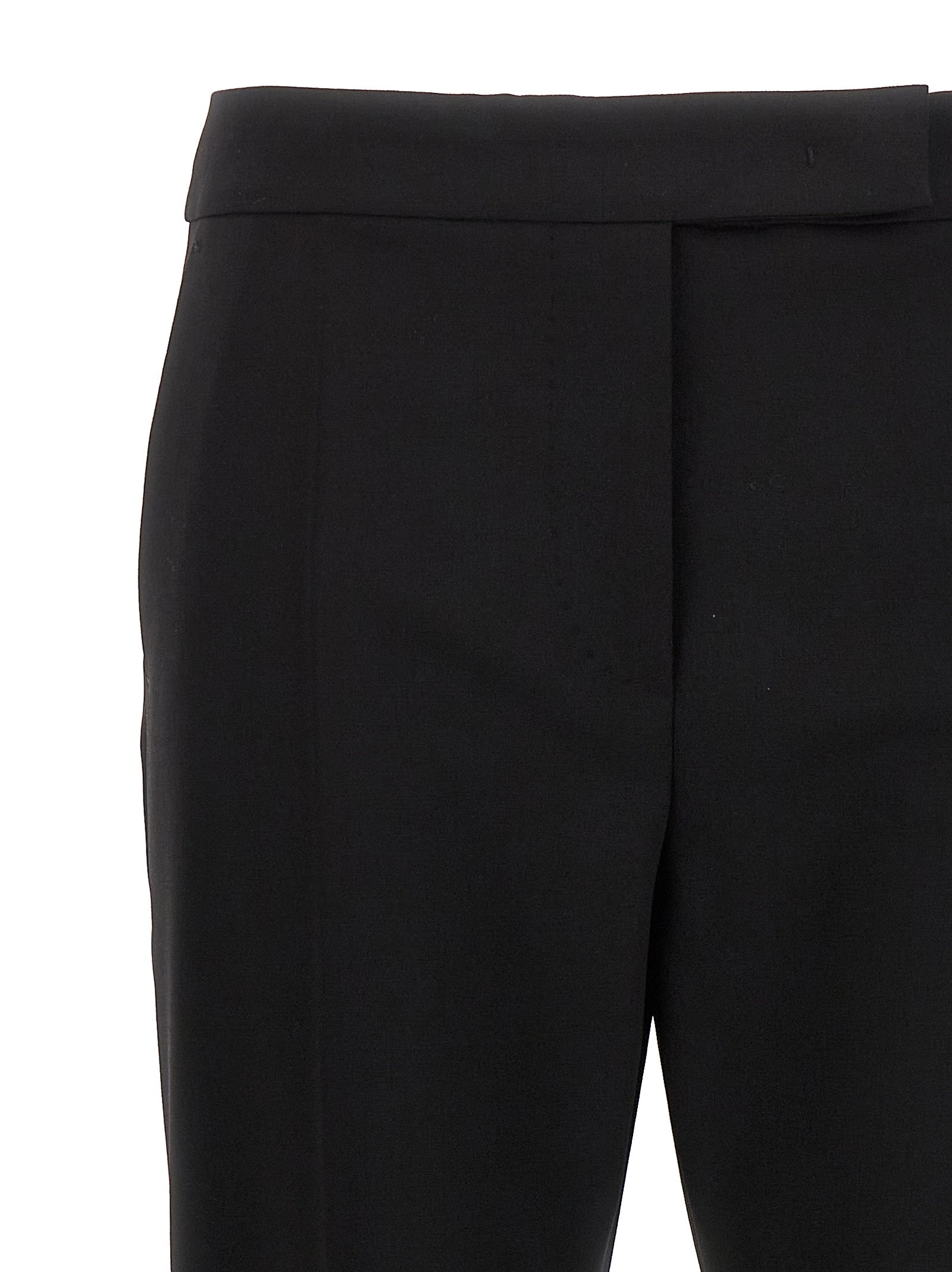 Elevate your wardrobe with Max Mara's Black Virgin Wool Dress Pants, a timeless blend of luxury and sophistication, perfect for any elegant occasion.