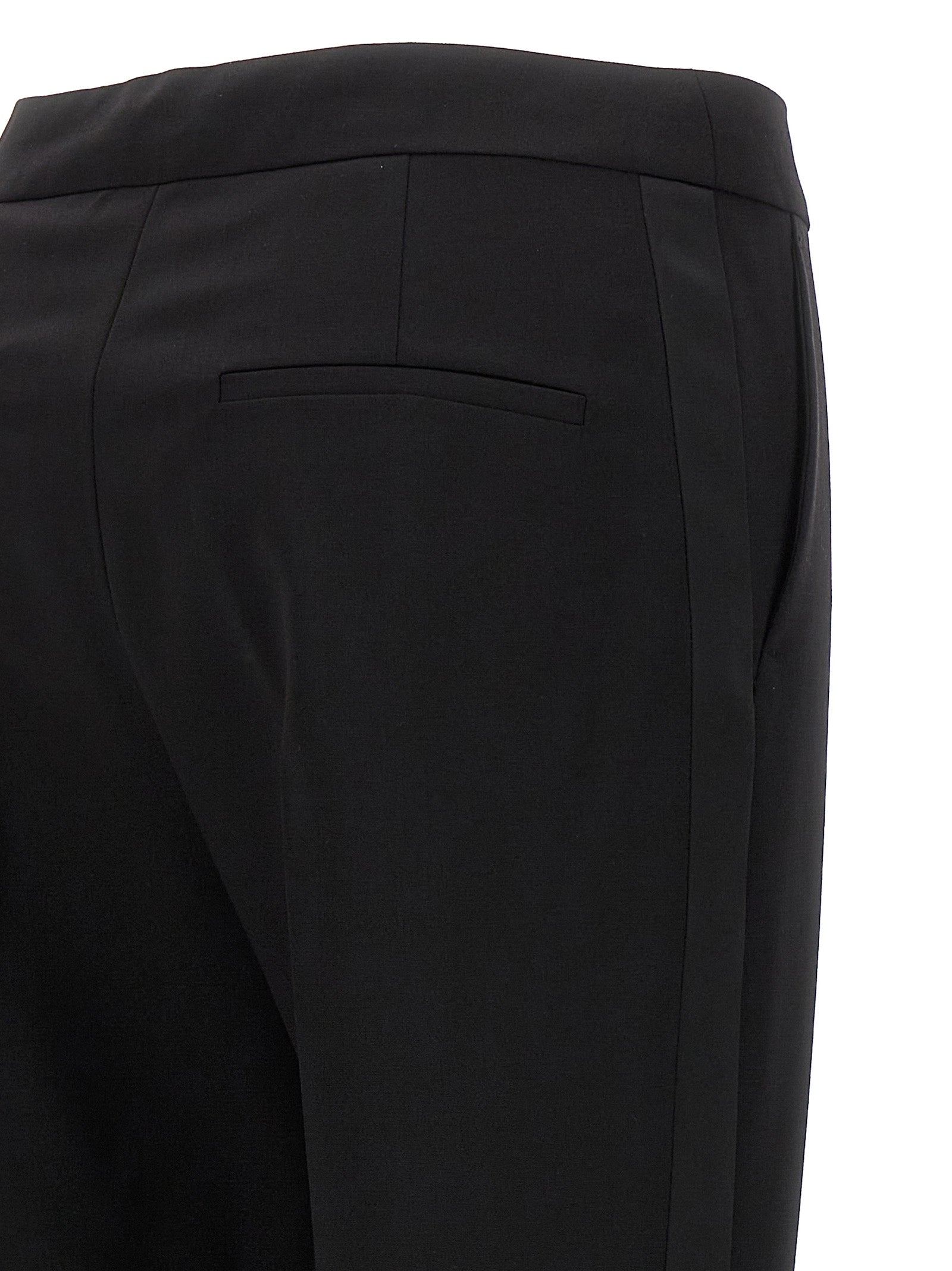 Elevate your wardrobe with Max Mara's Black Virgin Wool Dress Pants, a luxurious blend of elegance and comfort, crafted in Italy for timeless sophistication.