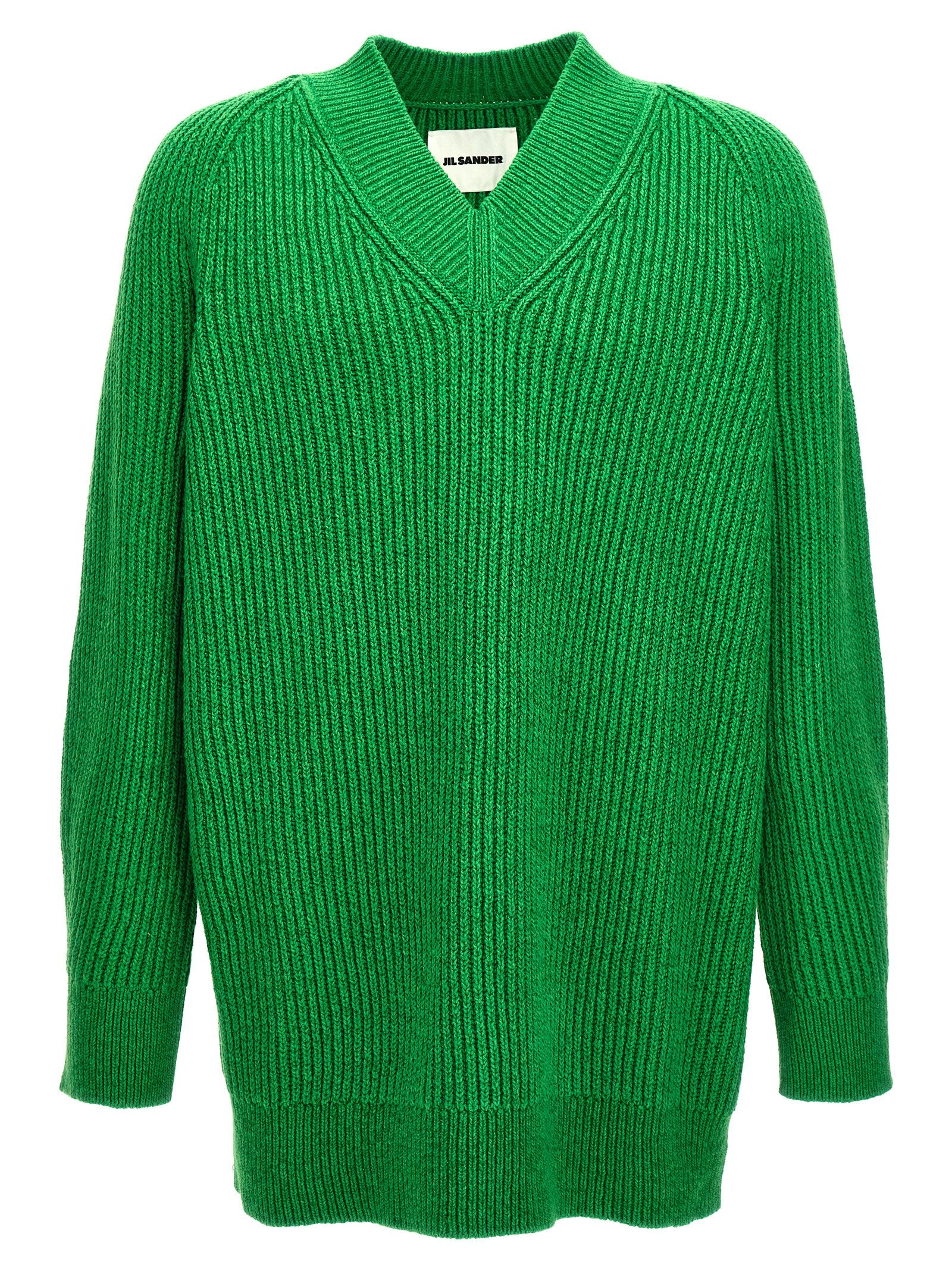 Experience the exquisite Jil Sander Bicolor Cotton Cardigan, a luxurious blend of cotton and wool that embodies timeless elegance and sophisticated style for the discerning individual.