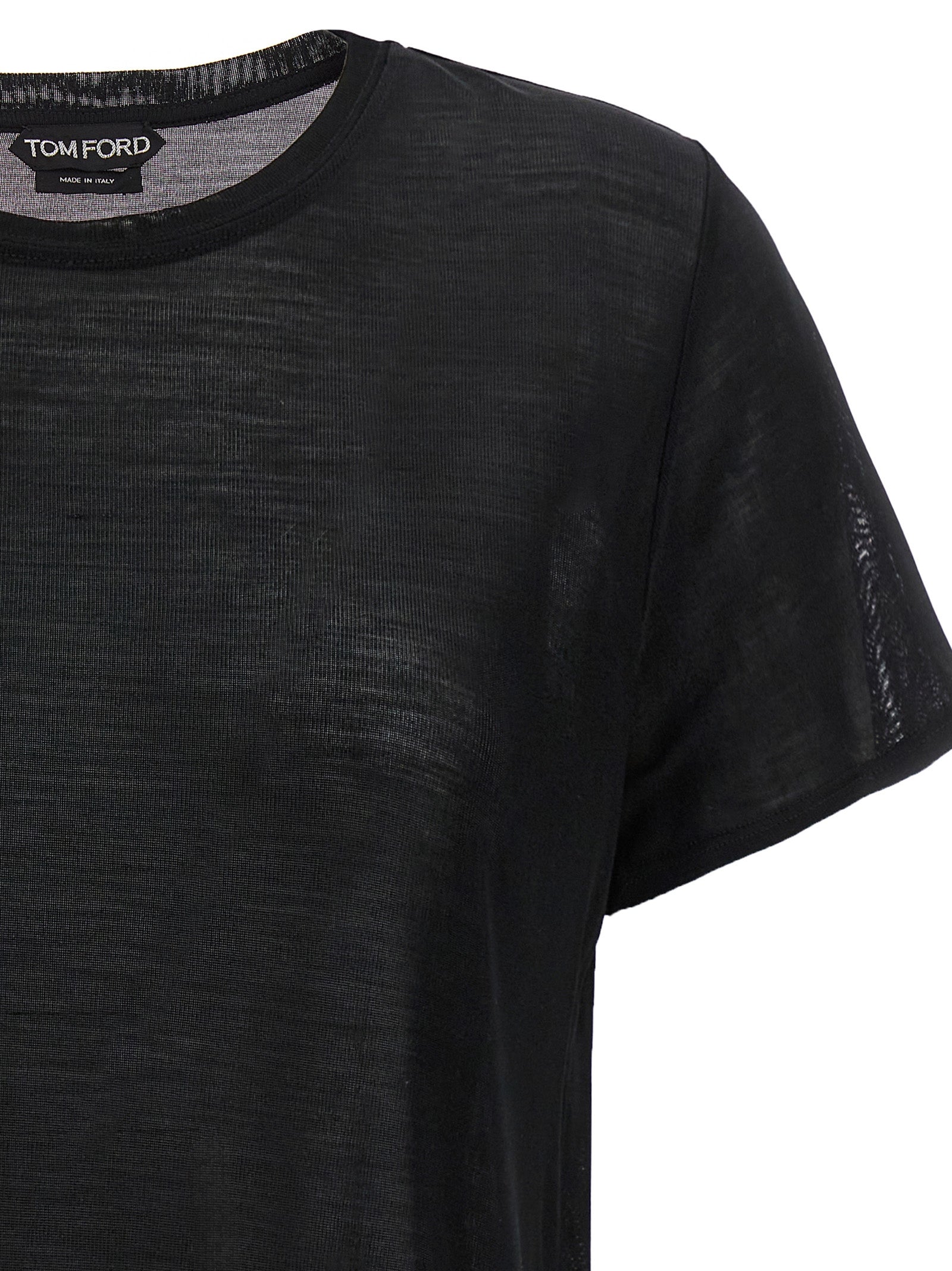 Indulge in the TOM FORD Black Silk T-Shirt, a luxurious staple crafted from 100% silk, embodying elegance and sophistication for every discerning wardrobe.