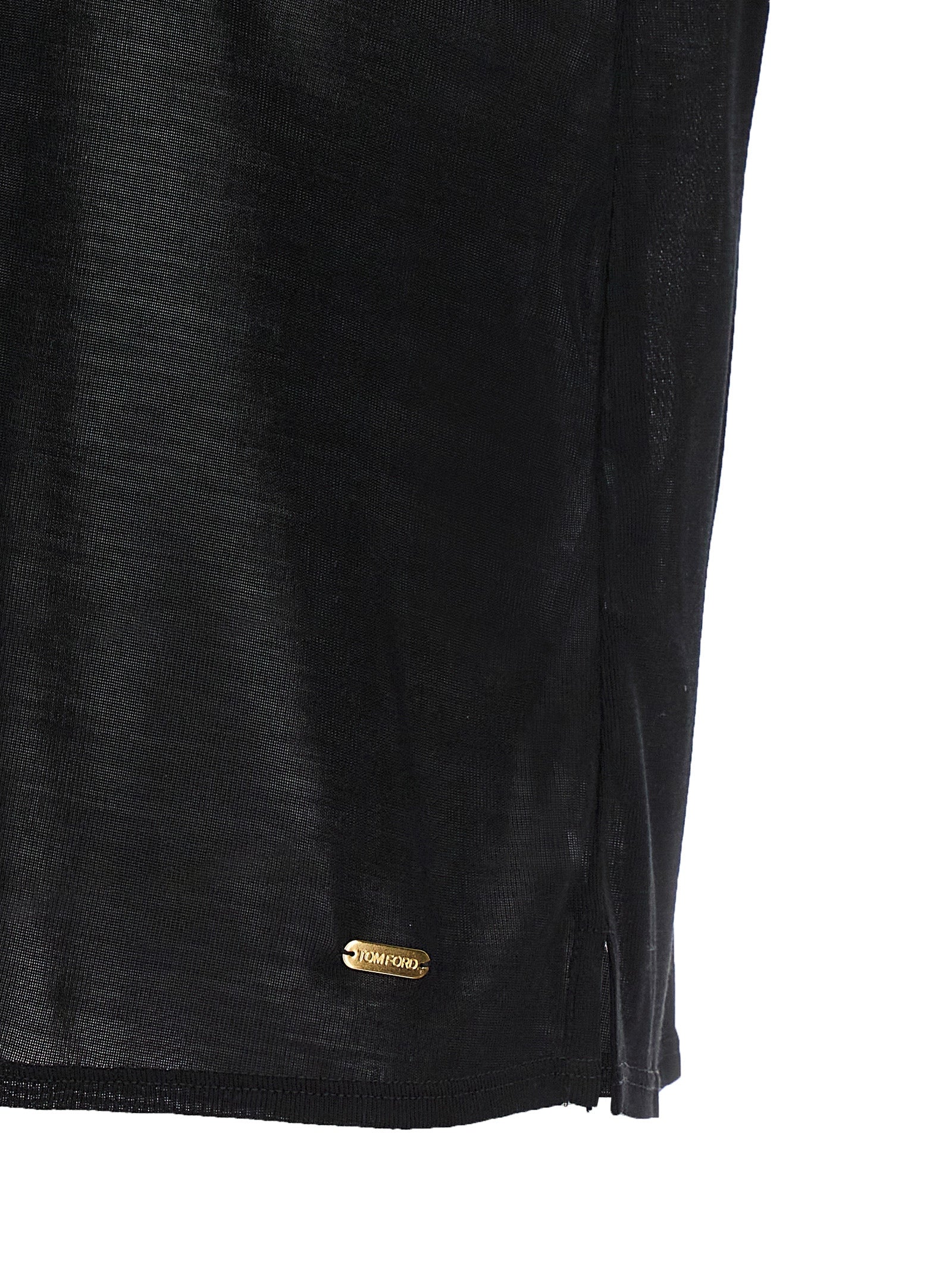 Indulge in the TOM FORD Black Silk T-Shirt, a masterpiece of Italian craftsmanship, offering unparalleled luxury and sophistication for the discerning wardrobe.