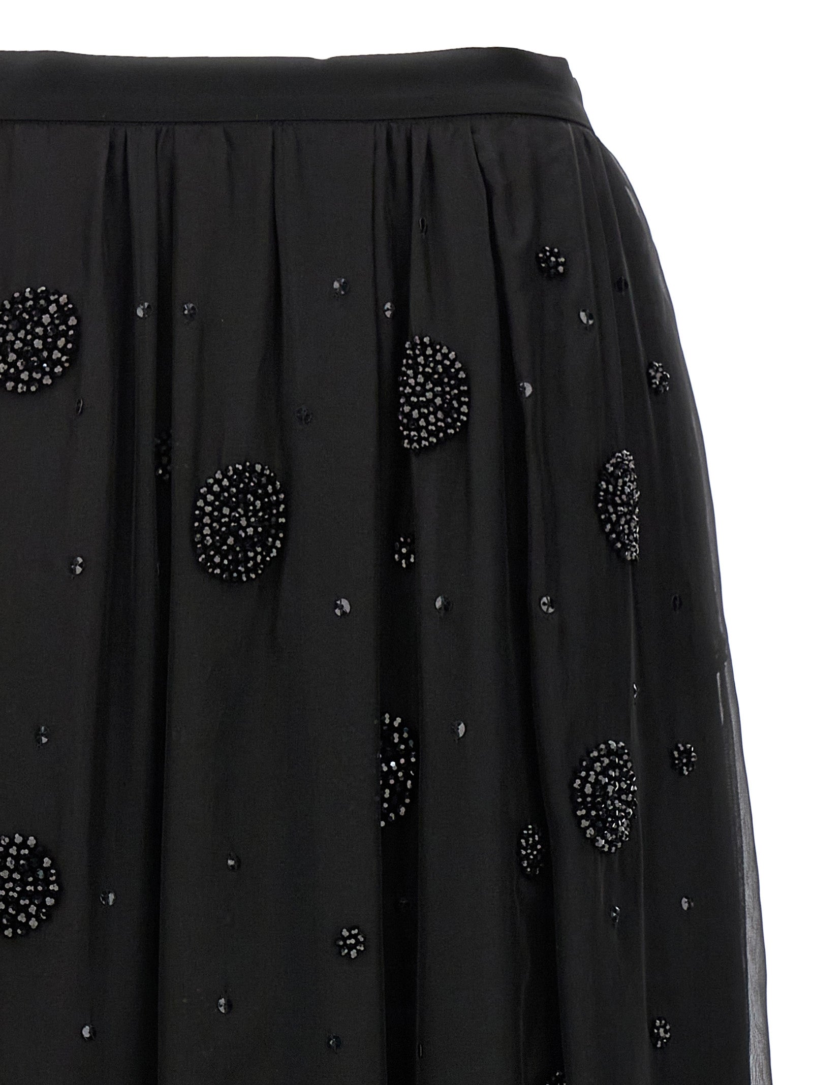 Elevate your wardrobe with the Max Mara Black Silk Midi Skirt, a timeless piece of luxury featuring exquisite silk and dazzling embellishments, perfect for any sophisticated occasion.
