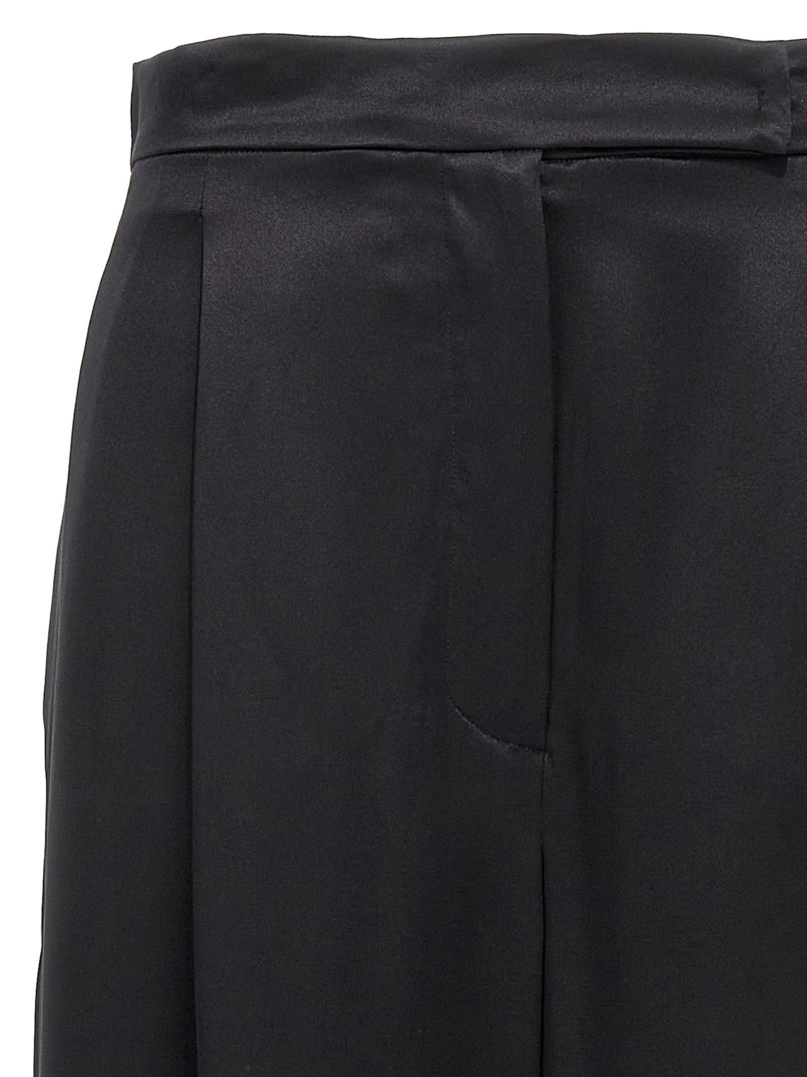 Experience the exquisite allure of Max Mara's Black Silk Casual Pants, crafted from 100% silk for a luxurious, effortless elegance that transcends occasions.
