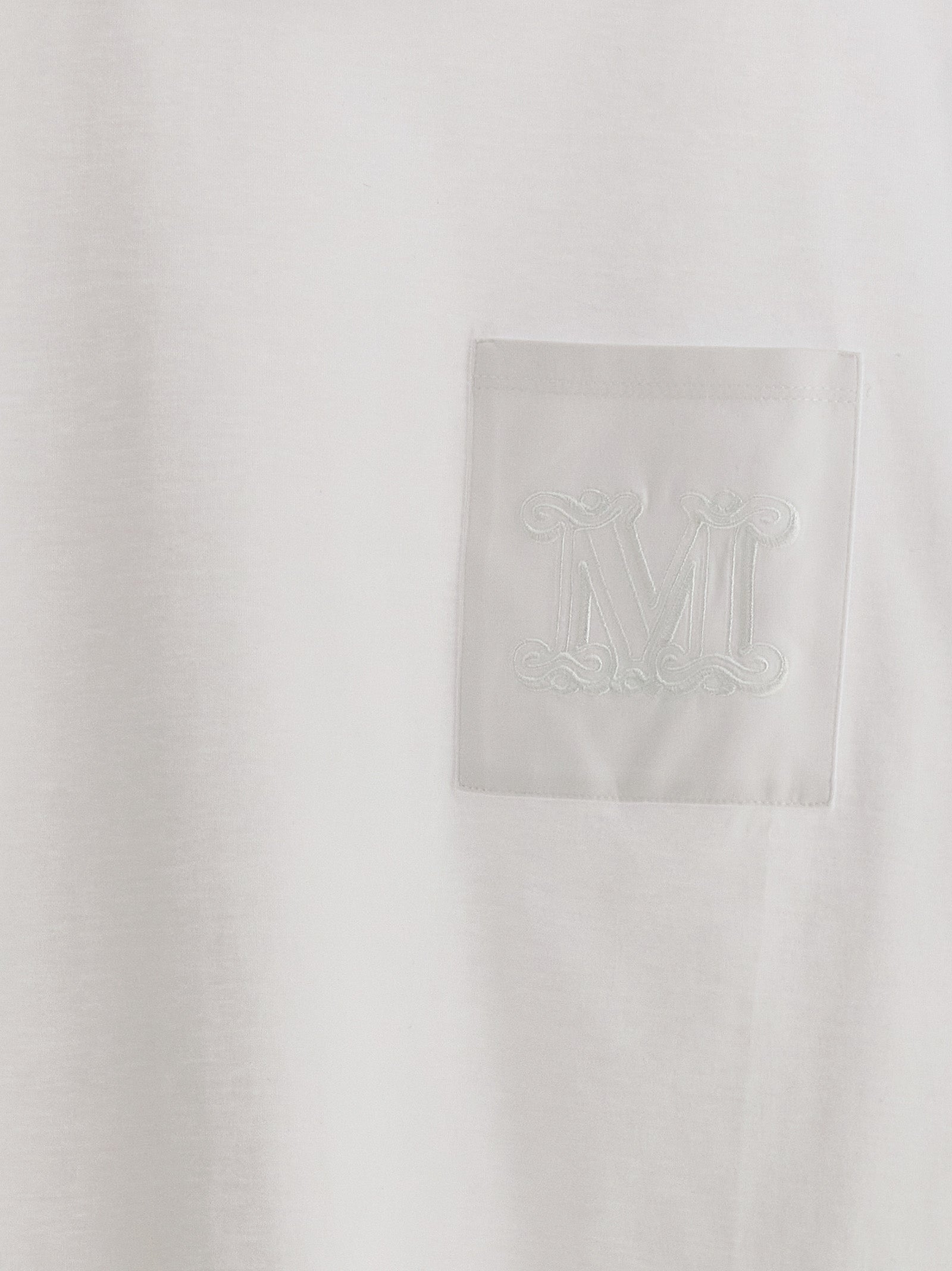 Elevate your wardrobe with the Max Mara White Cotton T-Shirt, a luxurious essential featuring artisanal craftsmanship and timeless elegance for the discerning individual.