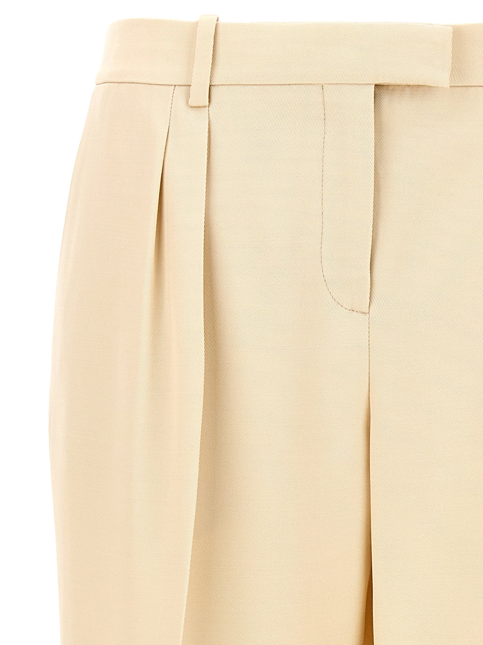 Elevate your elegance with Tom Ford's Beige Silk Dress Pants, a masterpiece of artisanal luxury blending silk and wool for timeless sophistication.