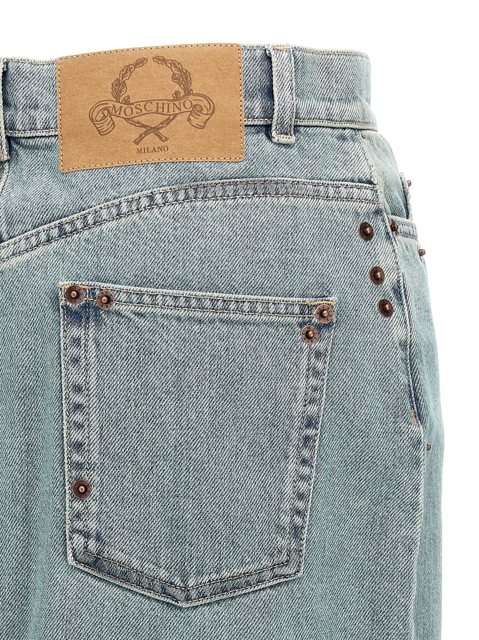Elevate your style with the Moschino Blue Cotton Midi Skirt, a masterpiece of artisanal luxury, crafted in Italy with exquisite metal rivets for a timeless allure.
