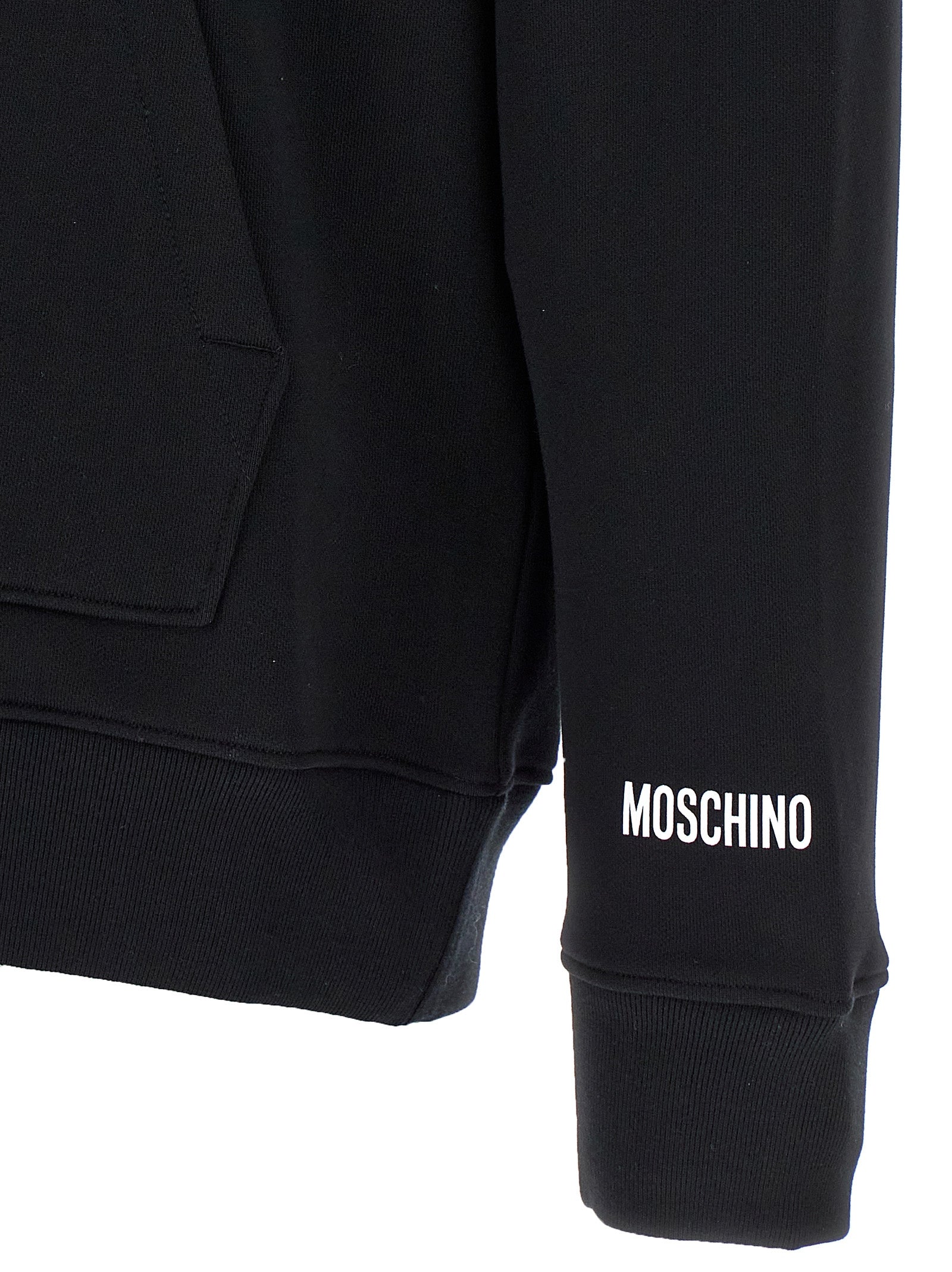 Elevate your style with the Moschino Black Cotton Hoodie, a luxurious statement piece crafted from premium cotton, embodying joy and sophistication for the discerning individual.