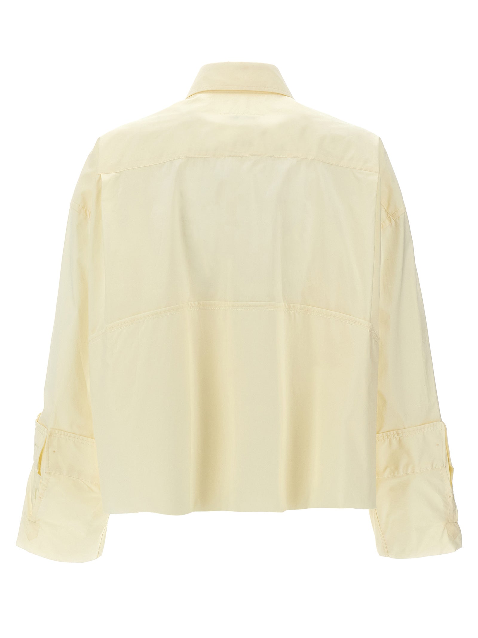 Experience the allure of the MM6 Maison Margiela White Cotton Blouse, where avant-garde design meets luxurious craftsmanship, perfect for the discerning fashion connoisseur.
