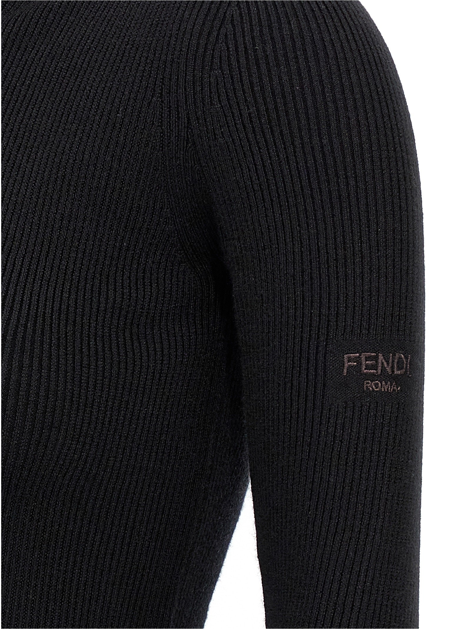 Elevate your style with the Fendi Black Wool Short Dress, a luxurious blend of wool and silk that embodies sophistication and modern allure, perfect for any occasion.