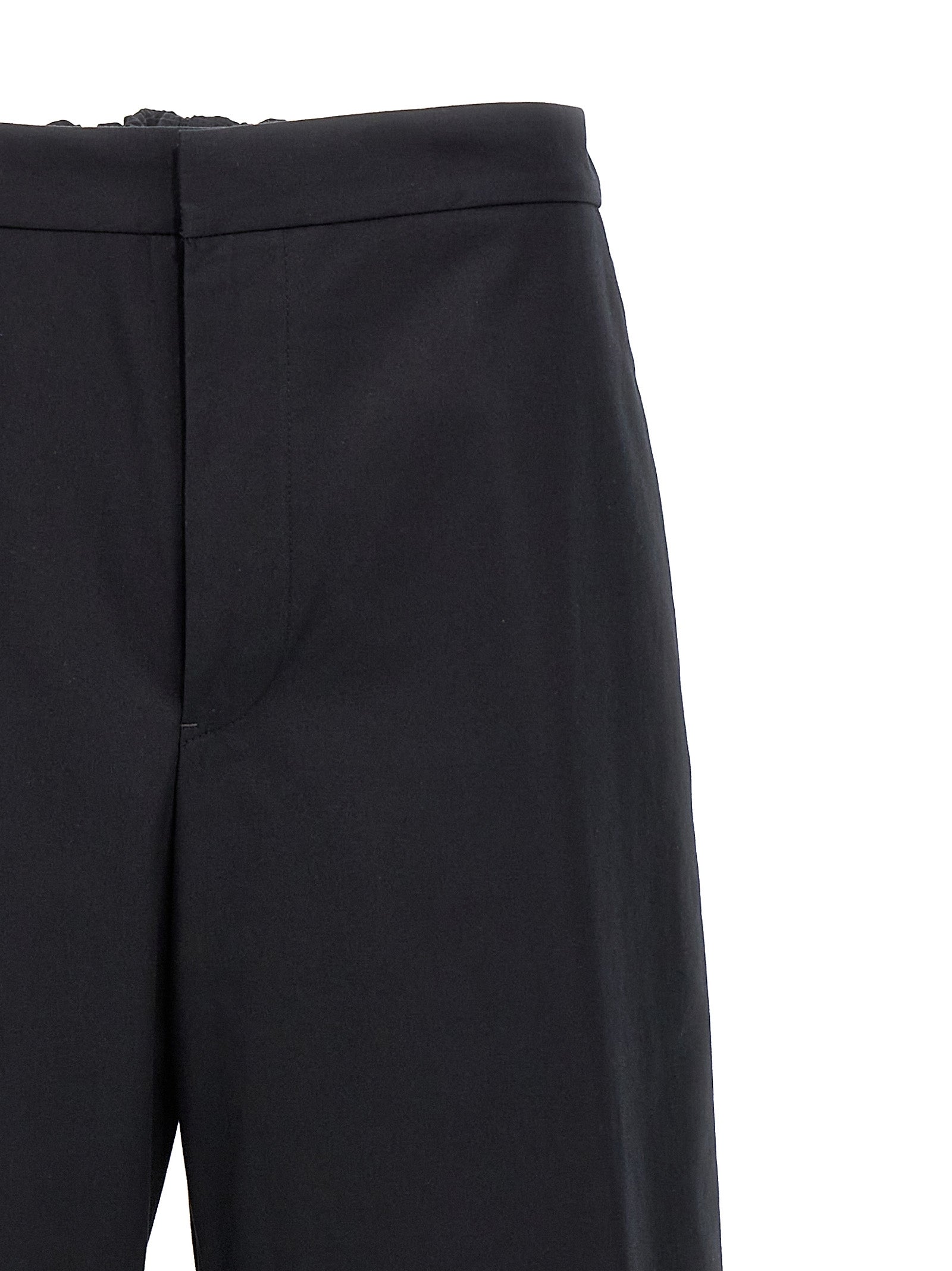 Experience the epitome of artisanal luxury with Jil Sander's blue cotton casual pants, where exquisite craftsmanship meets modern sophistication for the discerning trendsetter.