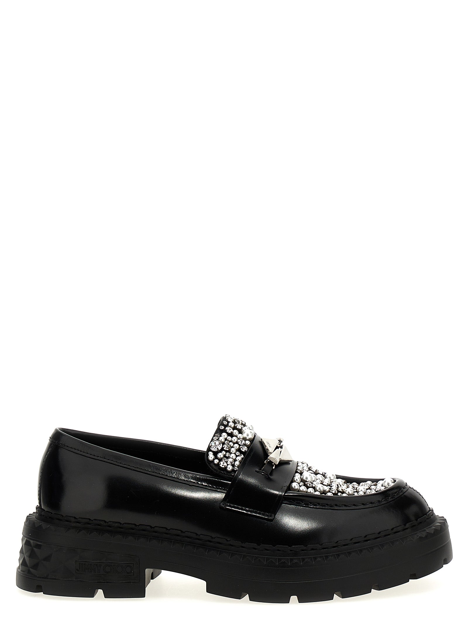 Discover the allure of Jimmy Choo's Black Calfskin Slip-On Loafers, where exquisite craftsmanship meets timeless elegance, perfect for the discerning individual.