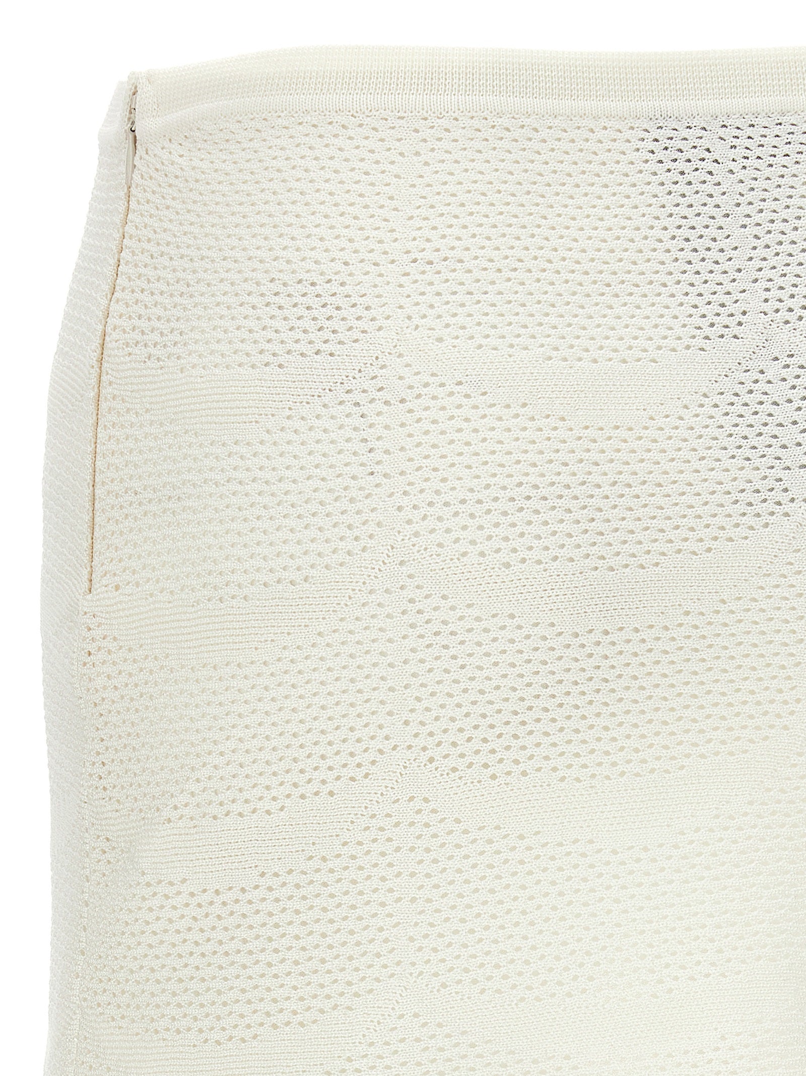 Indulge in the Tom Ford White Cotton Long Skirt, a luxurious blend of cotton and silk, showcasing exquisite craftsmanship and an elegant silhouette for the discerning fashionista.