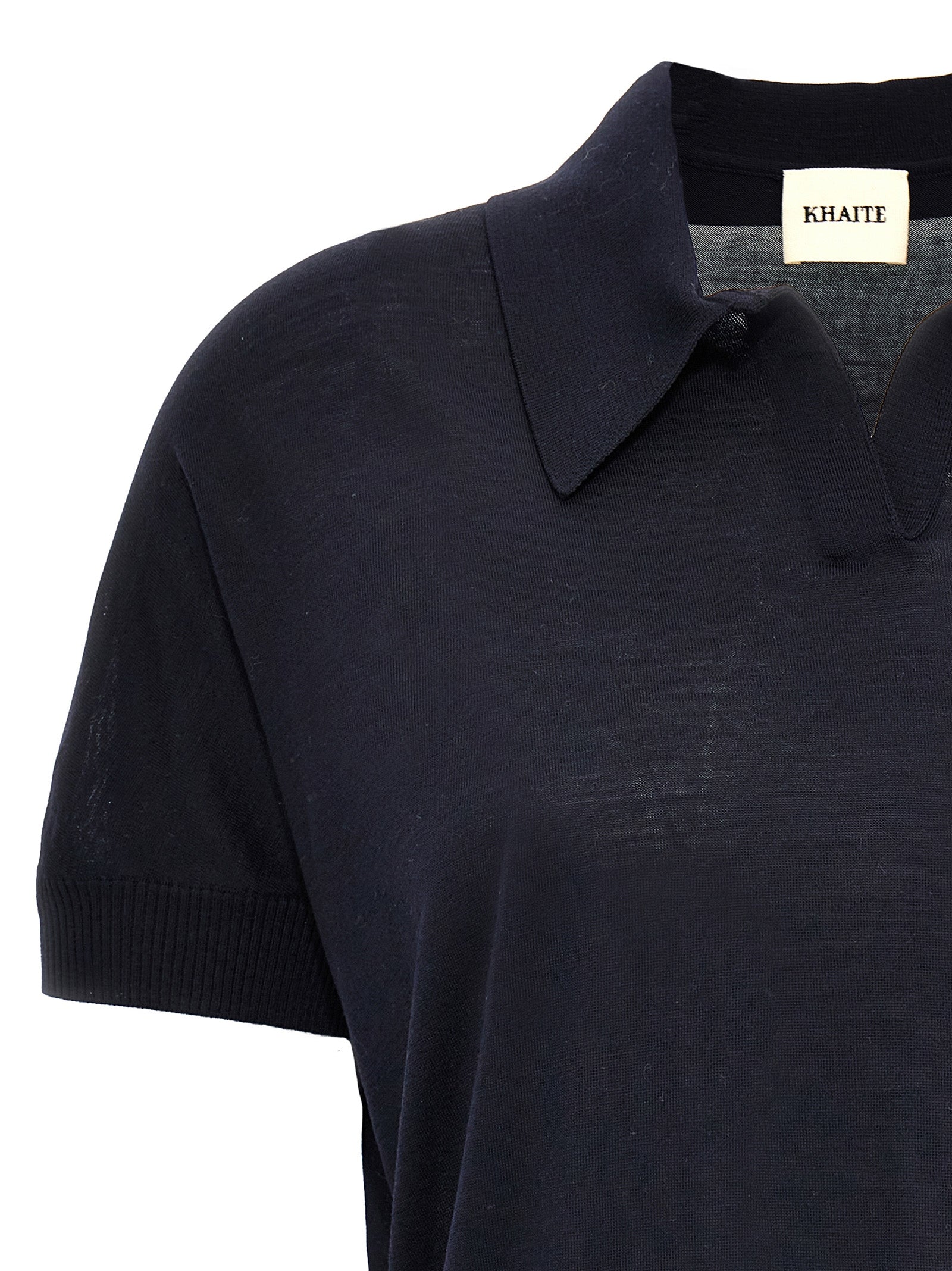 Elevate your elegance with KHAITE's Morgane crop top, a luxurious wool masterpiece in midnight blue, expertly crafted for timeless sophistication and effortless allure.