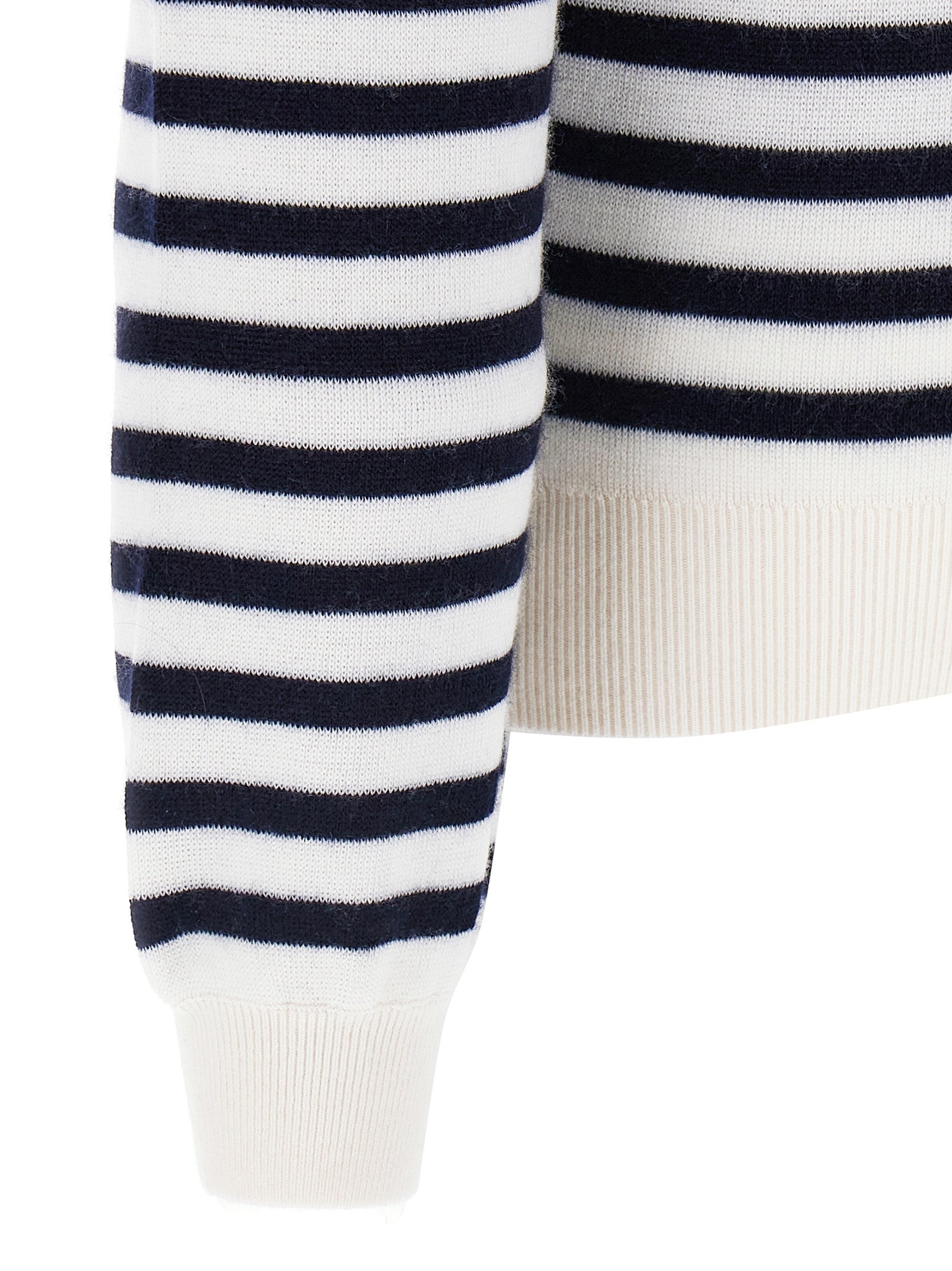 Indulge in the Khaite Bicolor Cashmere Cardigan, a luxurious blend of Mongolian cashmere and elastane, embodying timeless elegance and sophisticated allure for any discerning wardrobe.