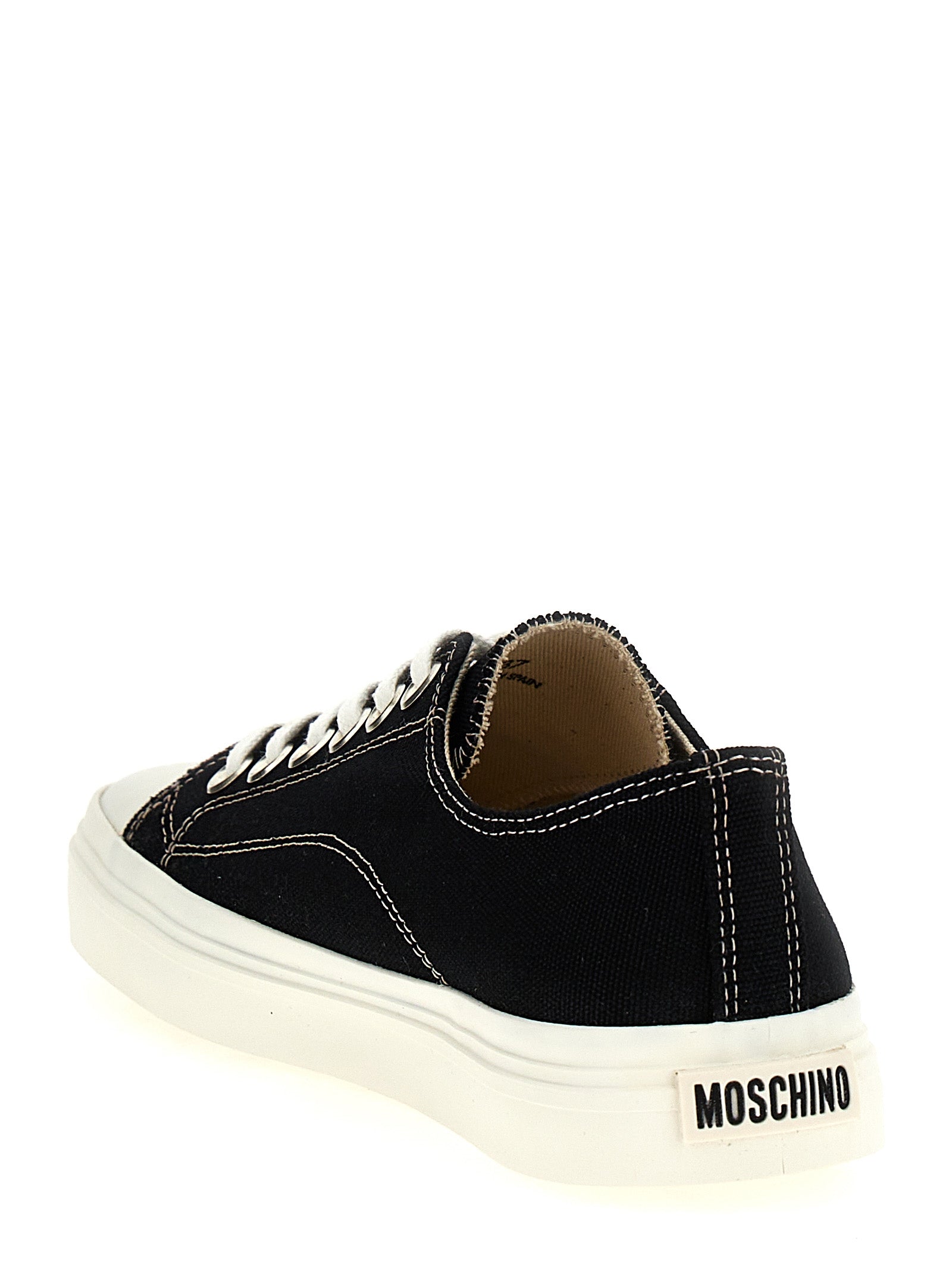 Elevate your style with Moschino's Black Cotton Low Top Sneakers, where exquisite craftsmanship meets bold design, perfect for the discerning trendsetter.