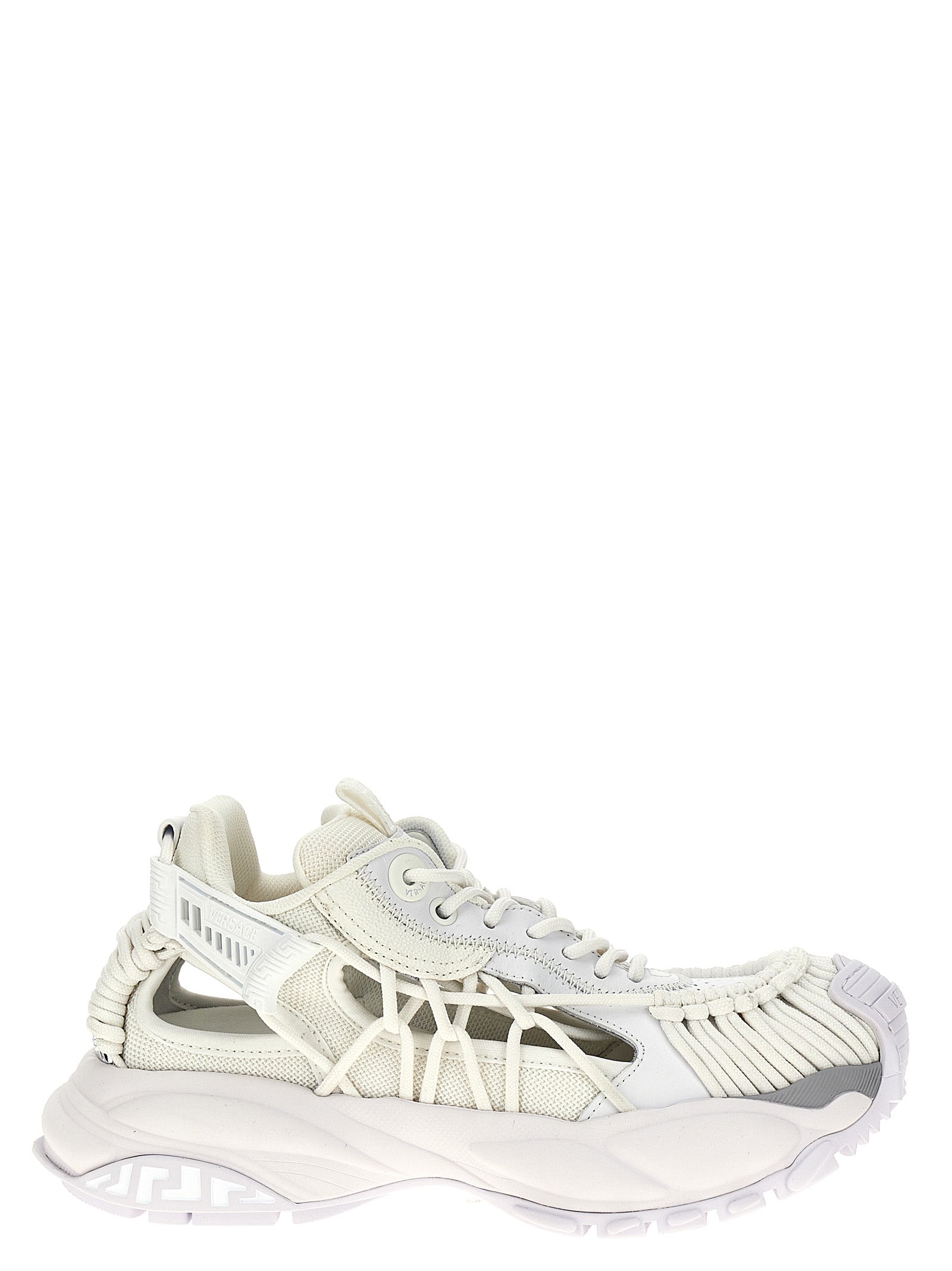 Step into a world of opulence with Versace White Calfskin Athletic Sneakers, where luxurious calfskin meets exquisite design, elevating your every stride.