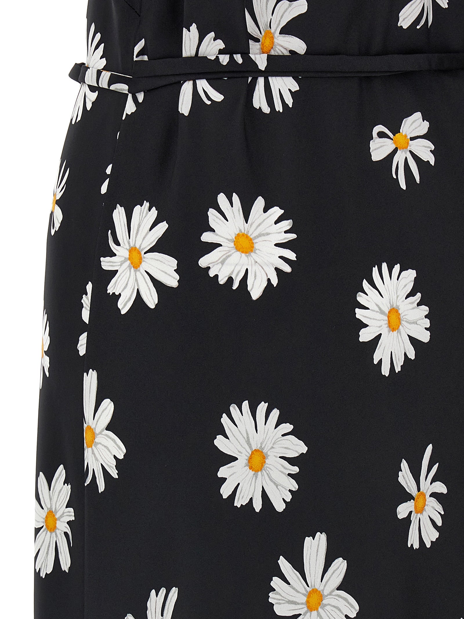 Experience the allure of the Moschino Black Silk Midi Dress, a masterpiece of artisanal luxury, crafted from pure silk and adorned with a captivating ‘Margherite’ print.