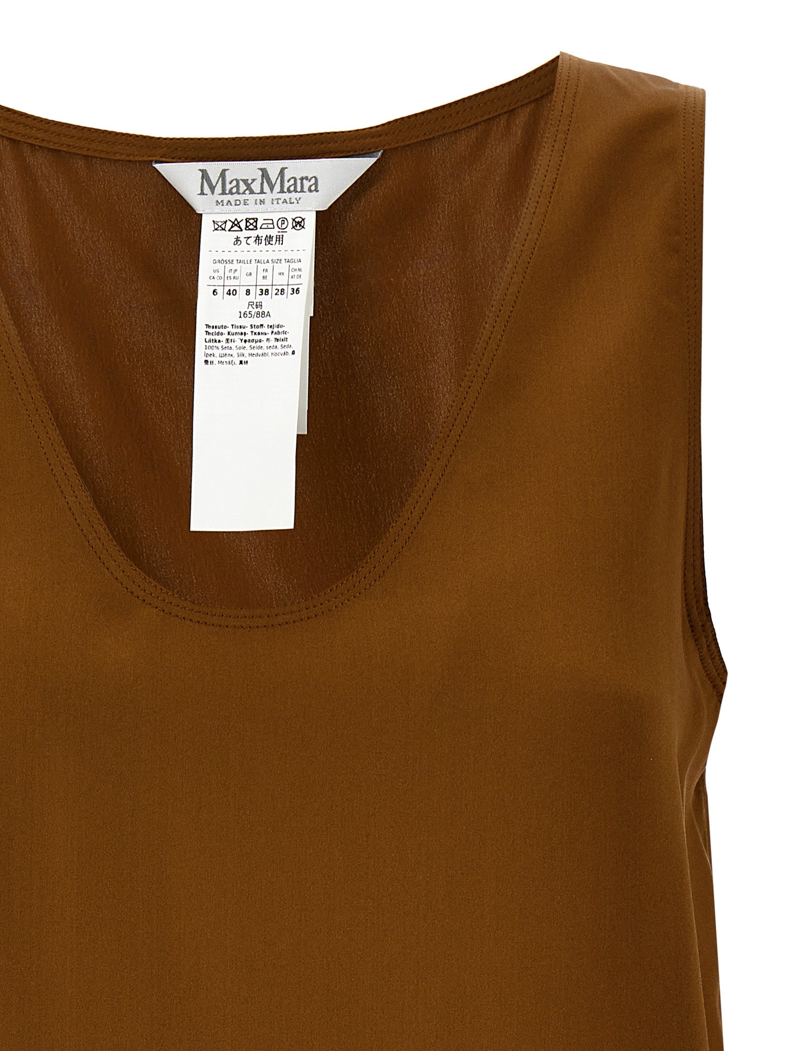 Discover the Max Mara Brown Silk Sleeveless T-Shirt, a masterpiece of Italian craftsmanship, blending timeless elegance with modern allure for the discerning individual.