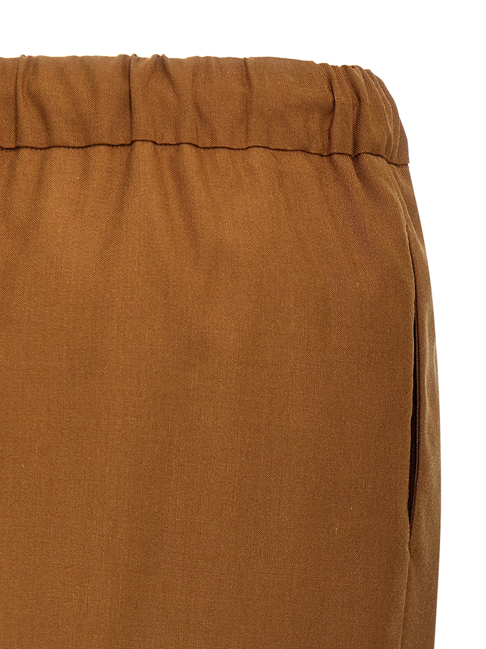 Discover the Max Mara Brown Virgin Wool Long Skirt, a luxurious blend of virgin wool, mohair, and silk, embodying timeless elegance and artisanal craftsmanship.