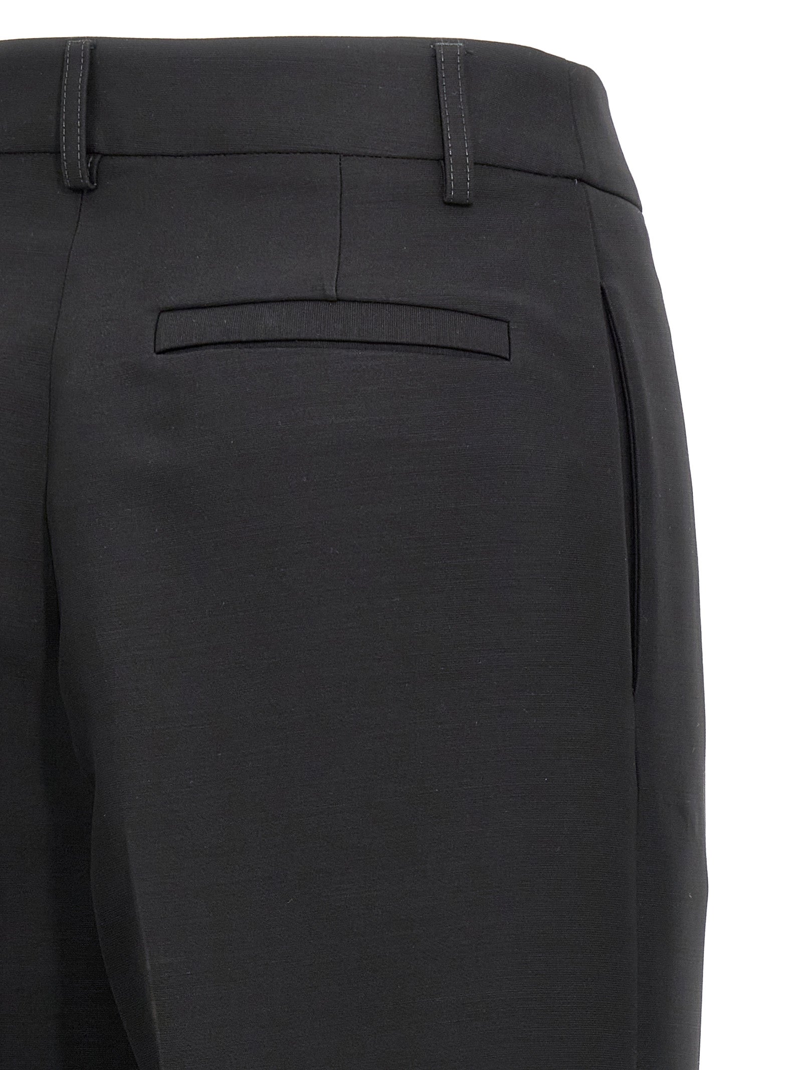Elevate your wardrobe with Ferragamo's Black Viscose Dress Pants, a luxurious blend of viscose and virgin wool, embodying timeless elegance and sophisticated craftsmanship.