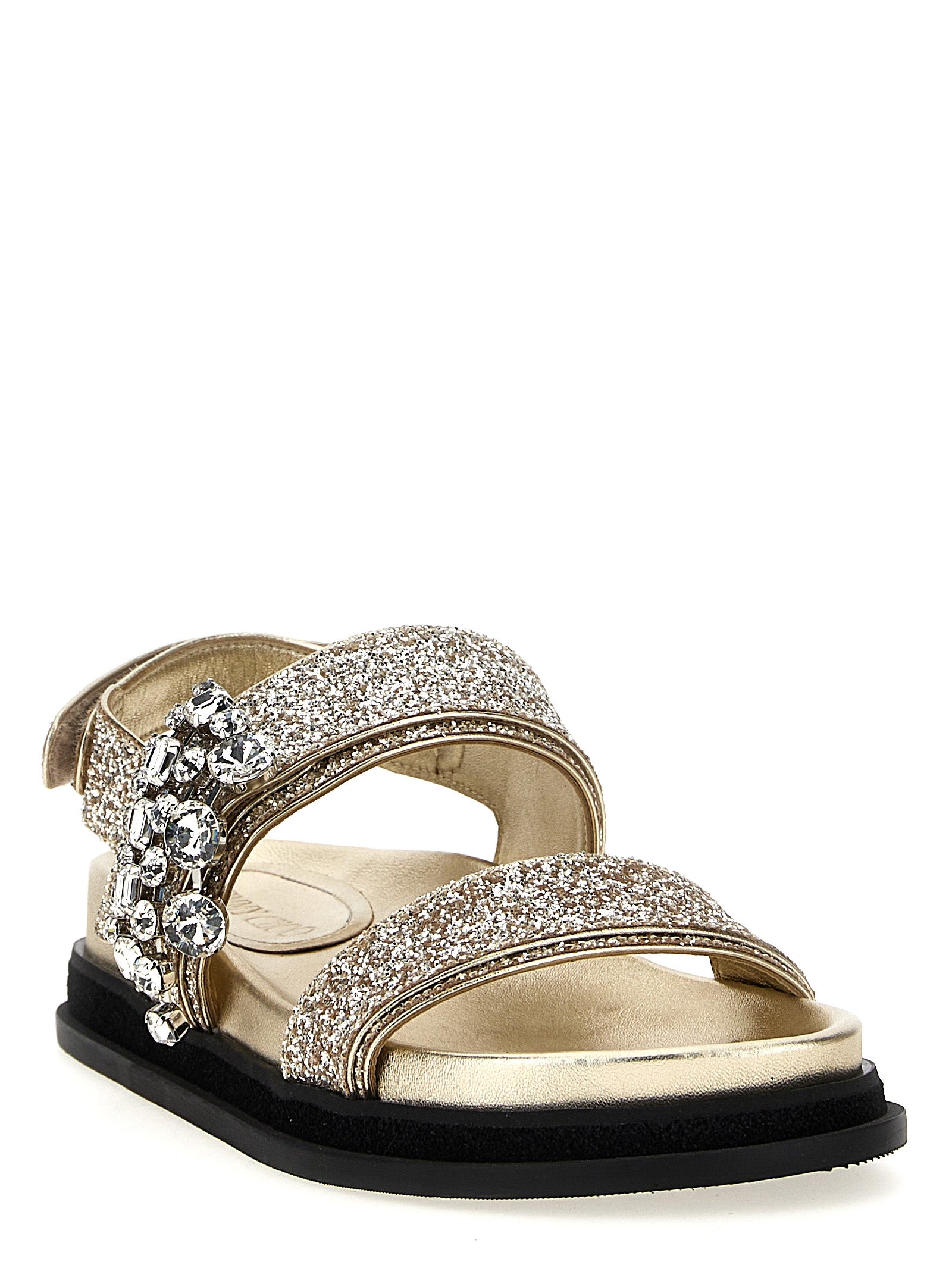 Step into opulence with Jimmy Choo Gold Textile Flat Sandals, where exquisite craftsmanship meets artisanal glitter elegance, perfect for the discerning connoisseur.
