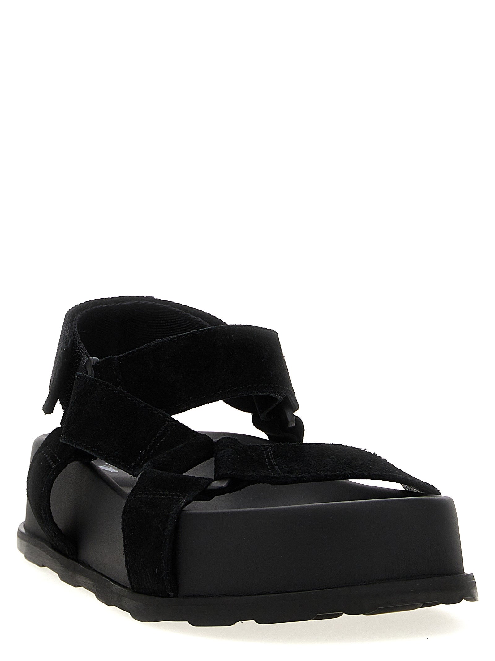 Step into a realm of sophistication with Moschino Black Calfskin Flat Sandals, where exquisite craftsmanship meets bold luxury for the discerning connoisseur.