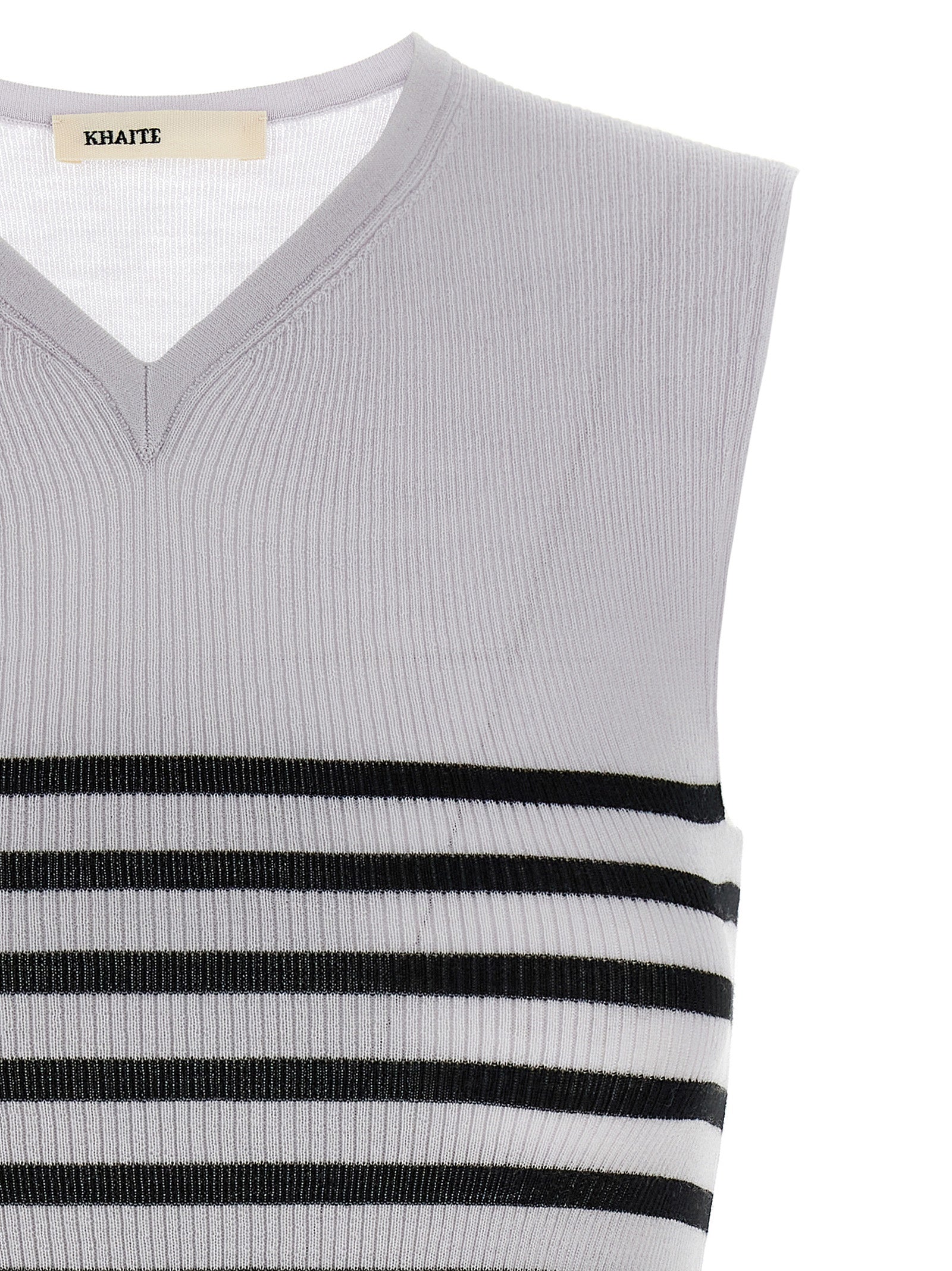 Elevate your wardrobe with Khaite's Bicolor Wool Sleeveless T-Shirt, crafted from luxurious Merino wool, embodying timeless elegance and sophisticated allure.