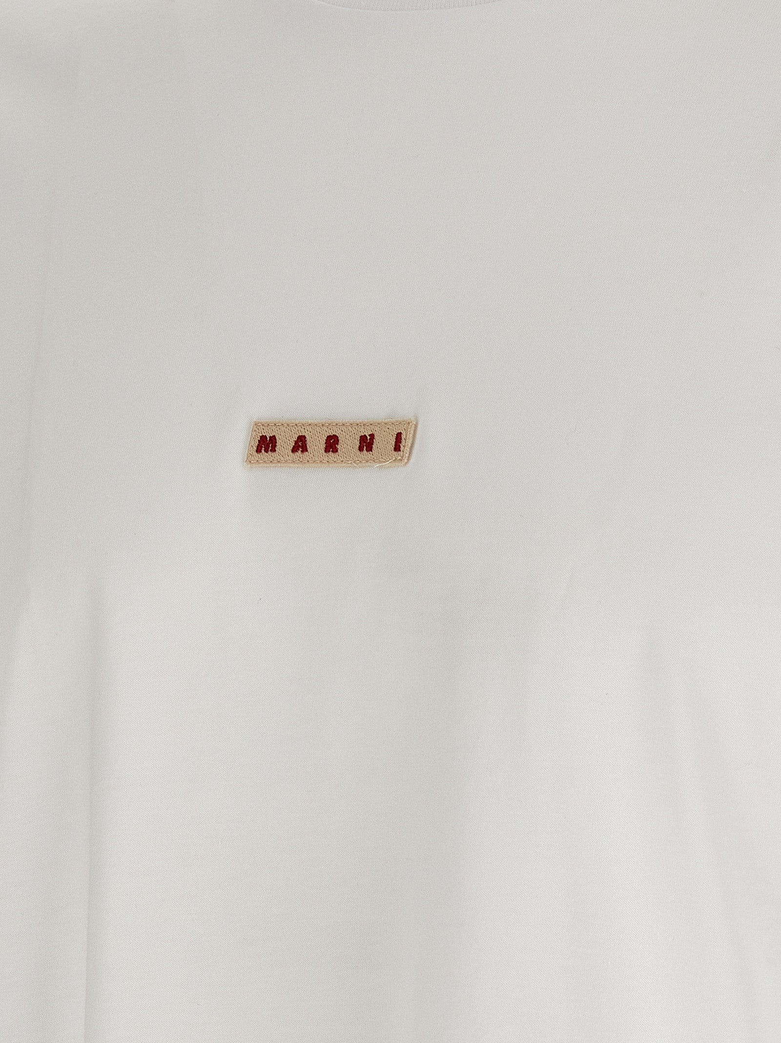 Elevate your wardrobe with the Marni White Cotton T-Shirt, a luxurious blend of contemporary style and comfort, perfect for discerning tastes and effortless elegance.