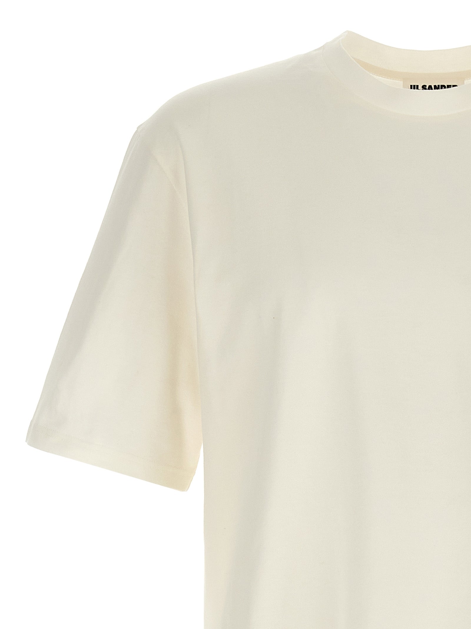 Experience the epitome of refined elegance with the Jil Sander White Cotton Long Sleeve T-Shirt, a luxurious staple that embodies timeless sophistication and modern allure.