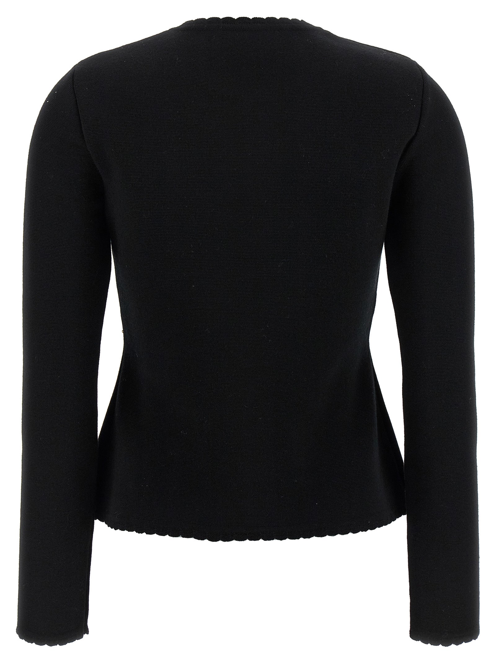 Indulge in the Moschino Black Virgin Wool Cardigan, a masterpiece of artisanal luxury, blending exquisite craftsmanship with timeless elegance for the discerning connoisseur.