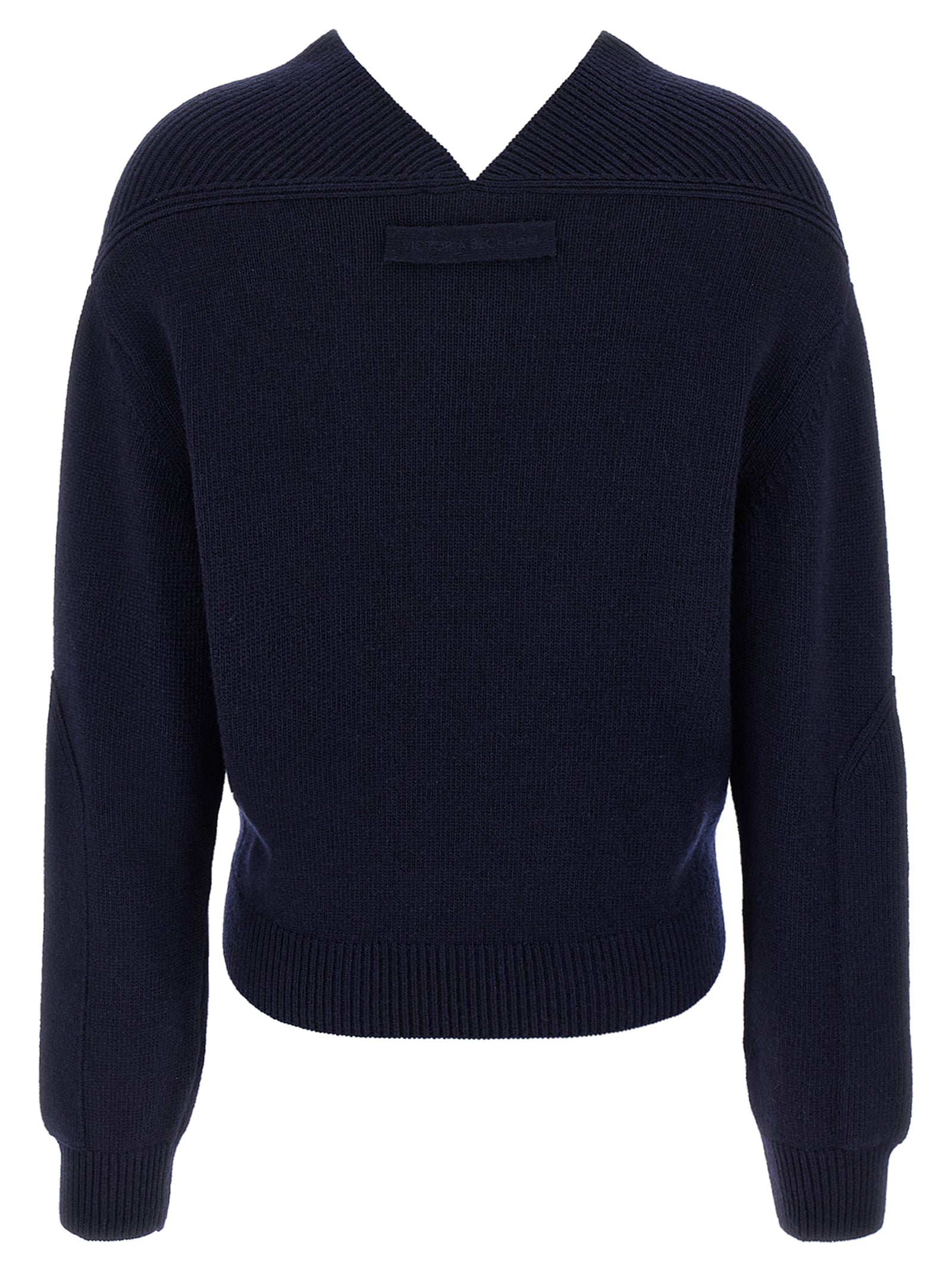 Elevate your style with the Victoria Beckham Blue Wool Cardigan, a luxurious blend of wool and cashmere that embodies timeless elegance and sophistication.