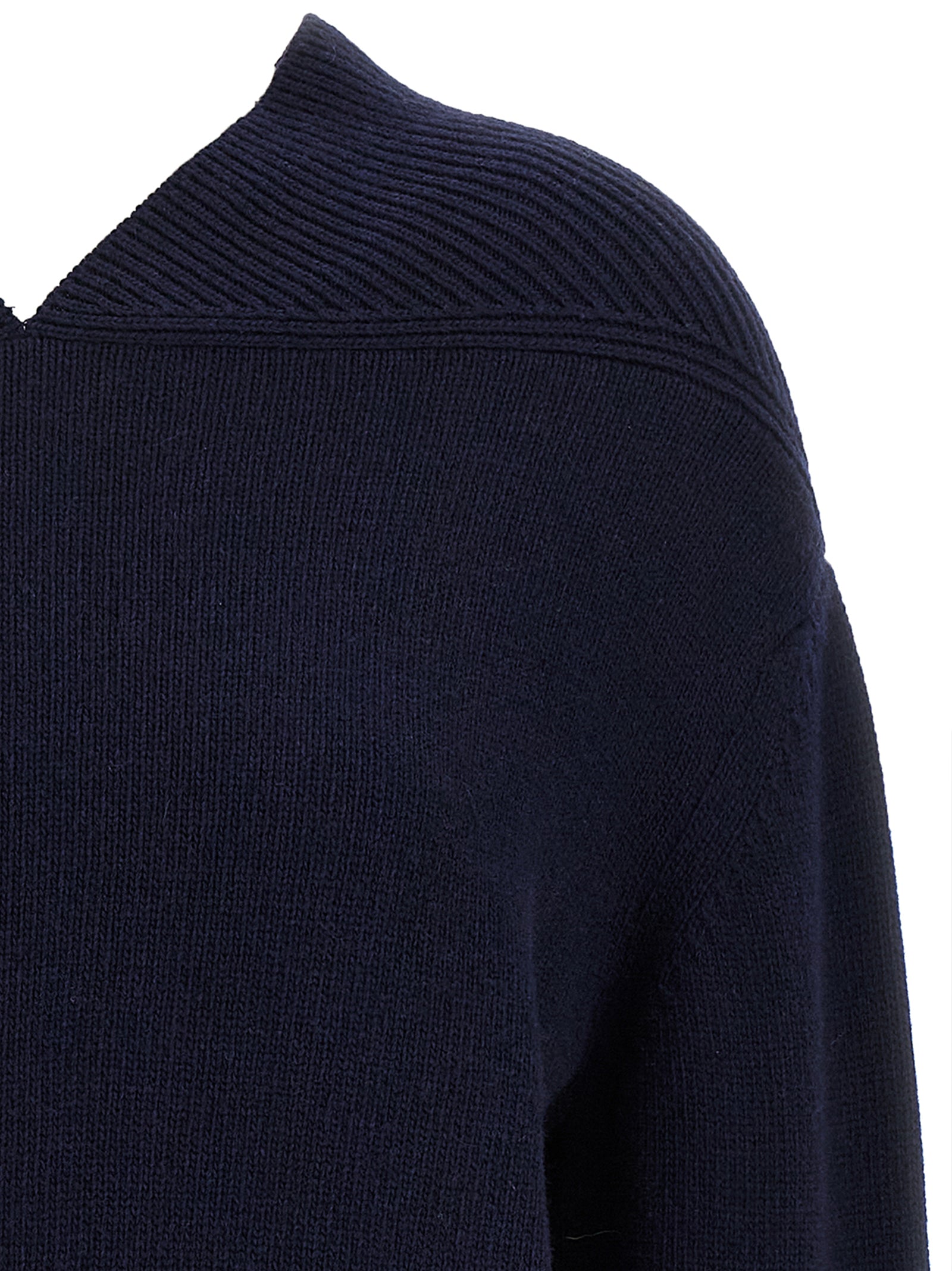 Elevate your style with the Victoria Beckham Blue Wool Cardigan, a luxurious blend of wool and cashmere, embodying timeless elegance and sophisticated allure.