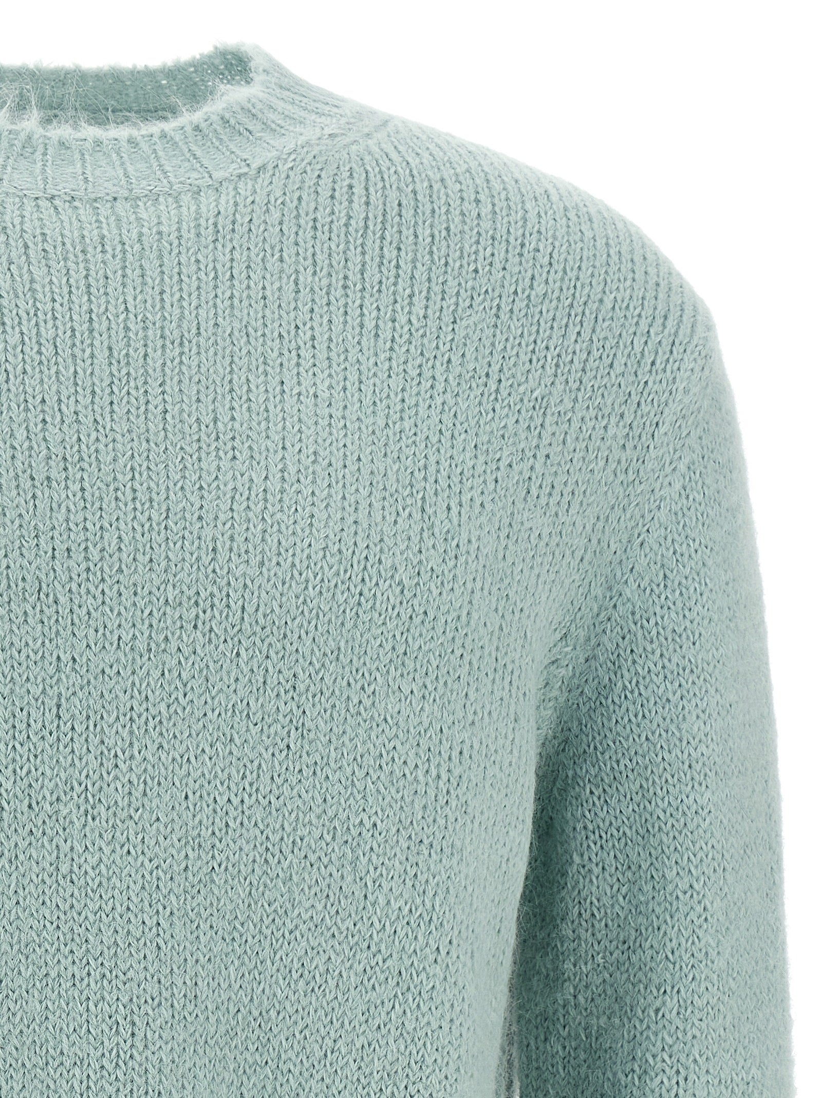 Indulge in the Jil Sander Blue Alpaca Leather Cardigan, a masterpiece of artisanal luxury crafted from premium alpaca wool, embodying timeless elegance and sophistication.