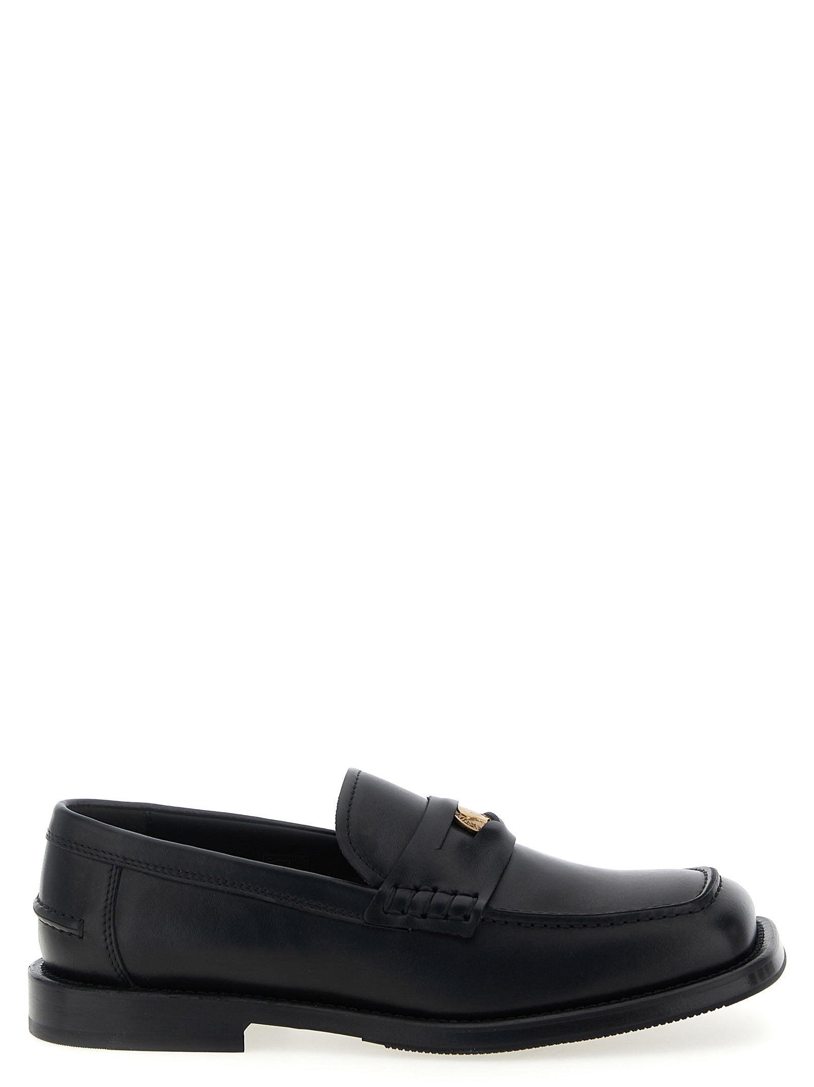 Indulge in the exquisite Moschino Black Velvet Leather Slip-On Loafers, where Italian craftsmanship meets bold design, elevating your style with timeless luxury.