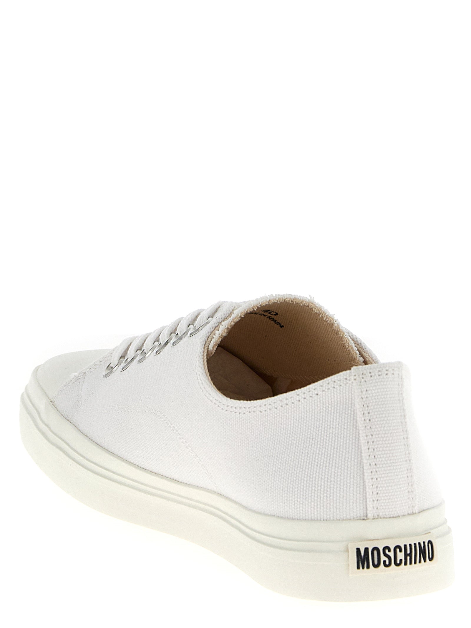 Indulge in the Moschino White Cotton Low Top Sneakers, where premium craftsmanship meets modern elegance, elevating your style with every step.