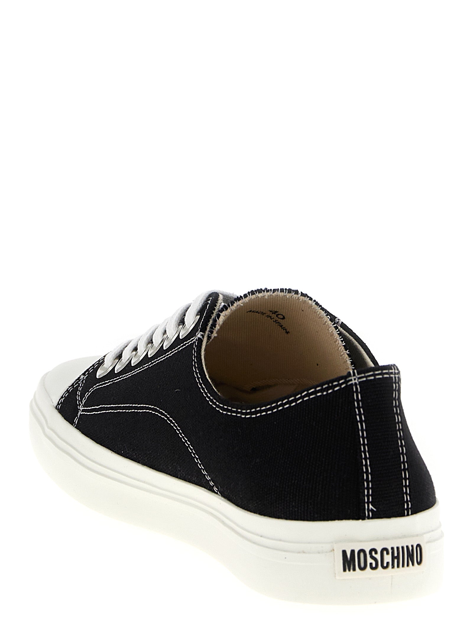 Discover the Moschino Bicolor Cotton Sneakers, where exquisite craftsmanship meets bold design, perfect for those who embody luxury and sophistication.